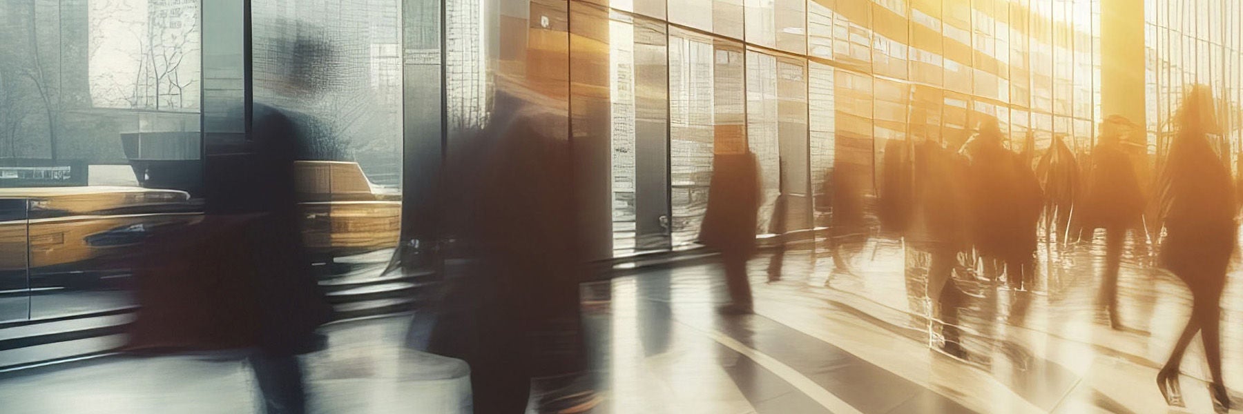 Long exposure shot of crowd of business people walking in bright office lobby fast moving with blur. Abstract blurred office interior space background. blue and orange colors. Business concept