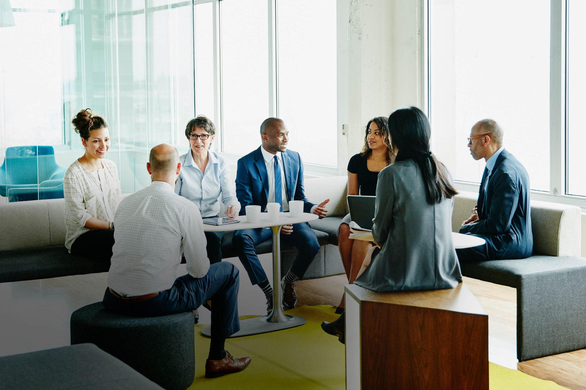 Group of businesspeople in discussion during project meeting in office