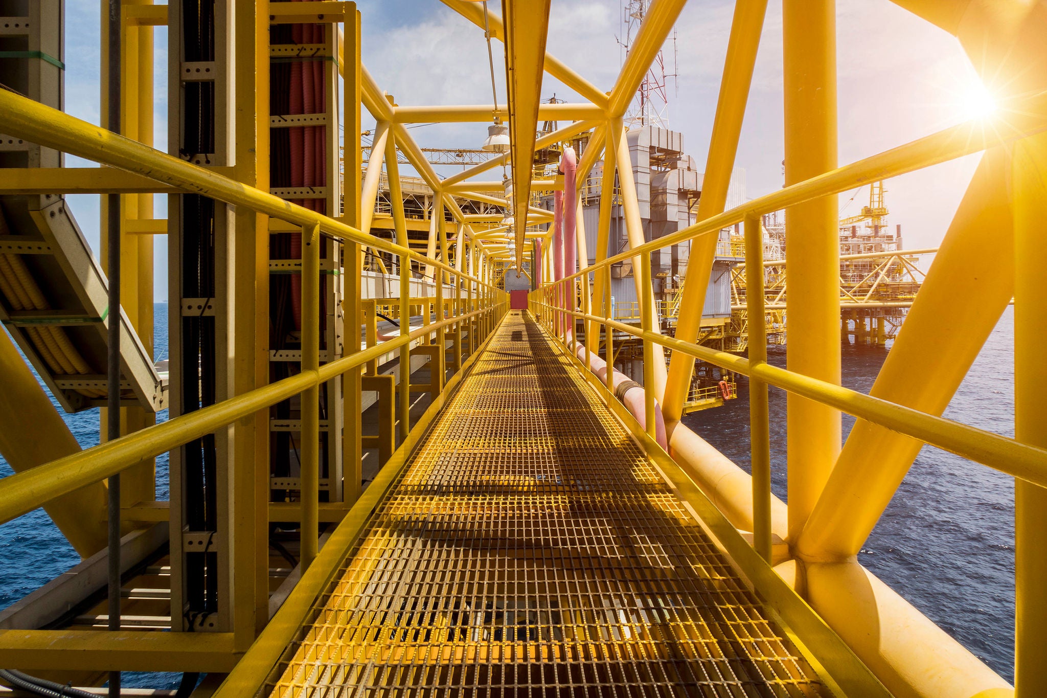 Oil and gas industrial platform walk way in the gulf or the sea, The world energy of oil and gas company