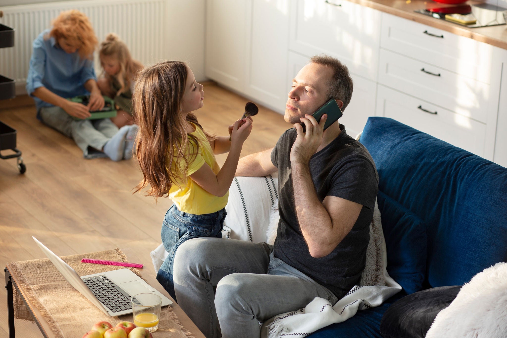 Parent trying to work from home surrounded by kids