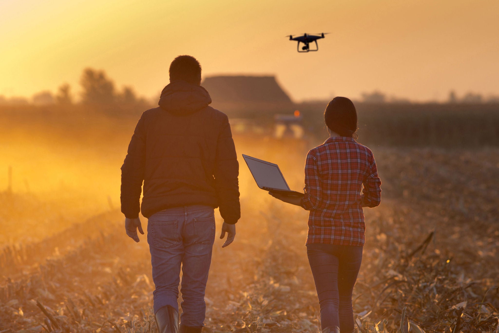 two people working on a drone