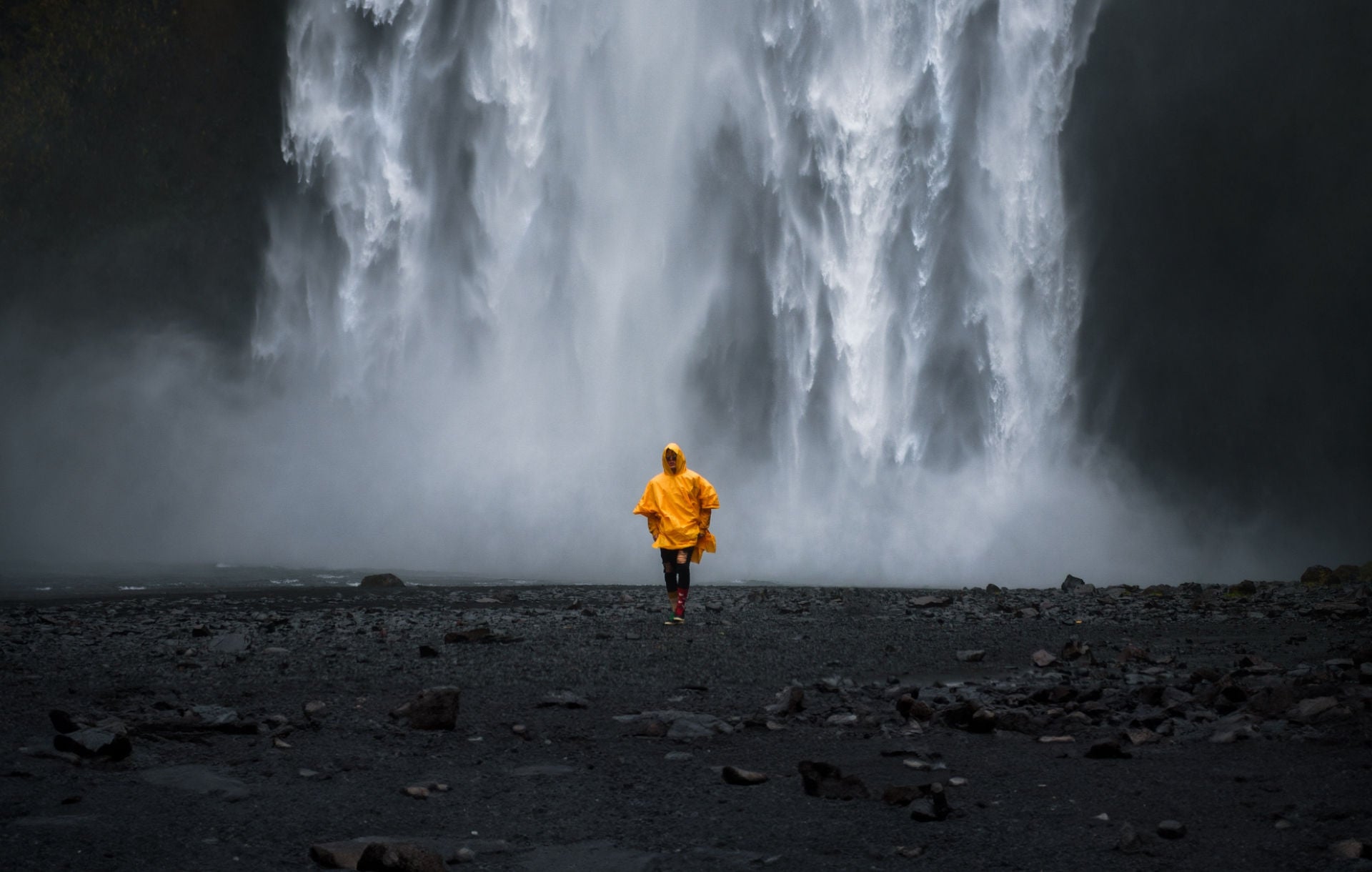 Man standing at the water falls