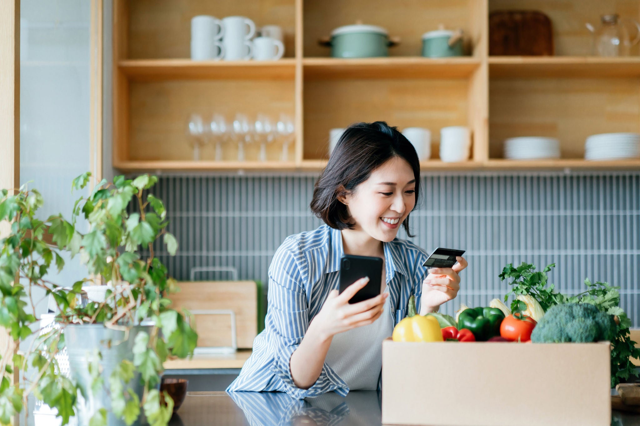 Woman checking her card after shopping