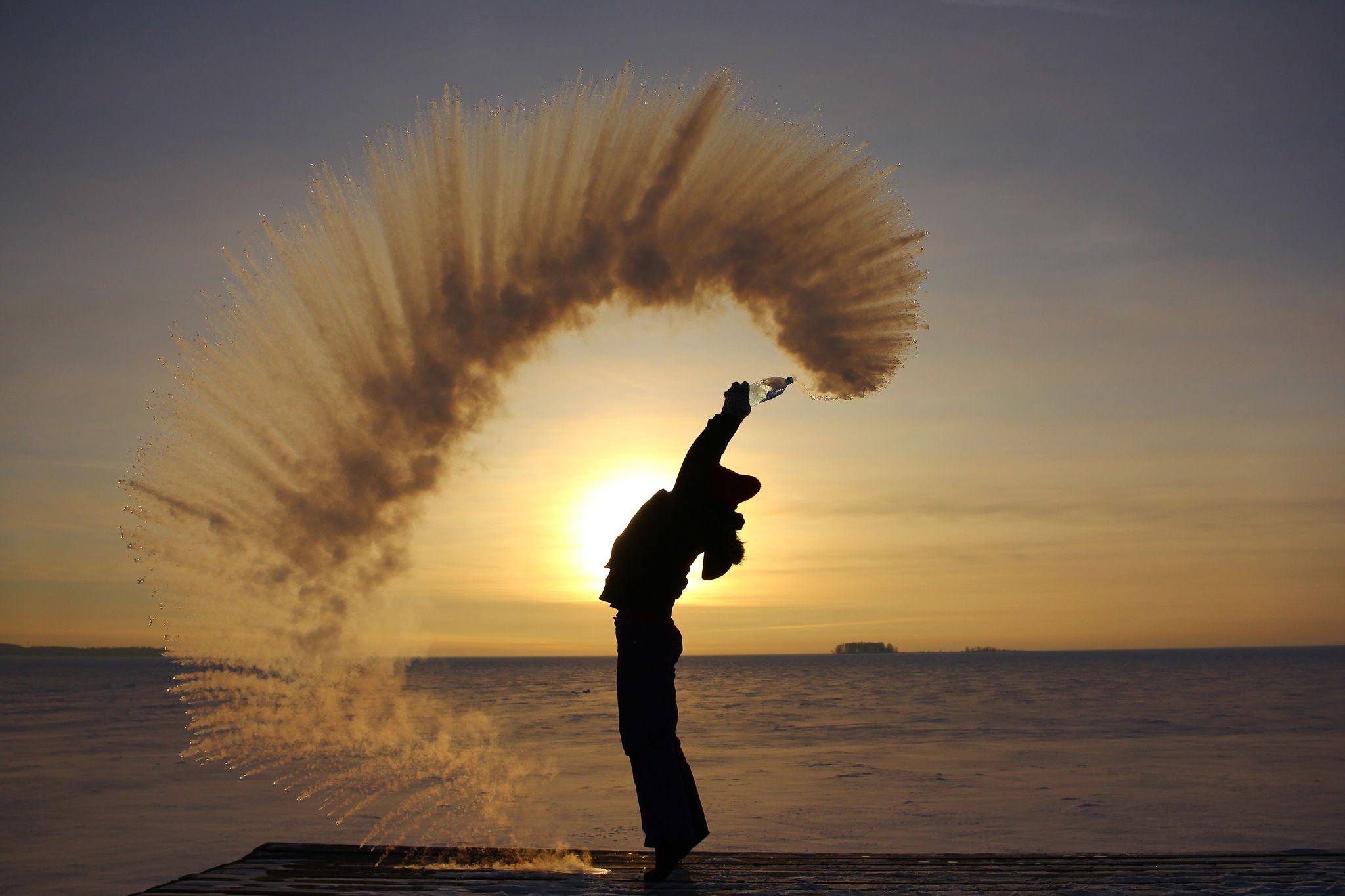 ey-woman-splashes-boiling-water-on-cold-air