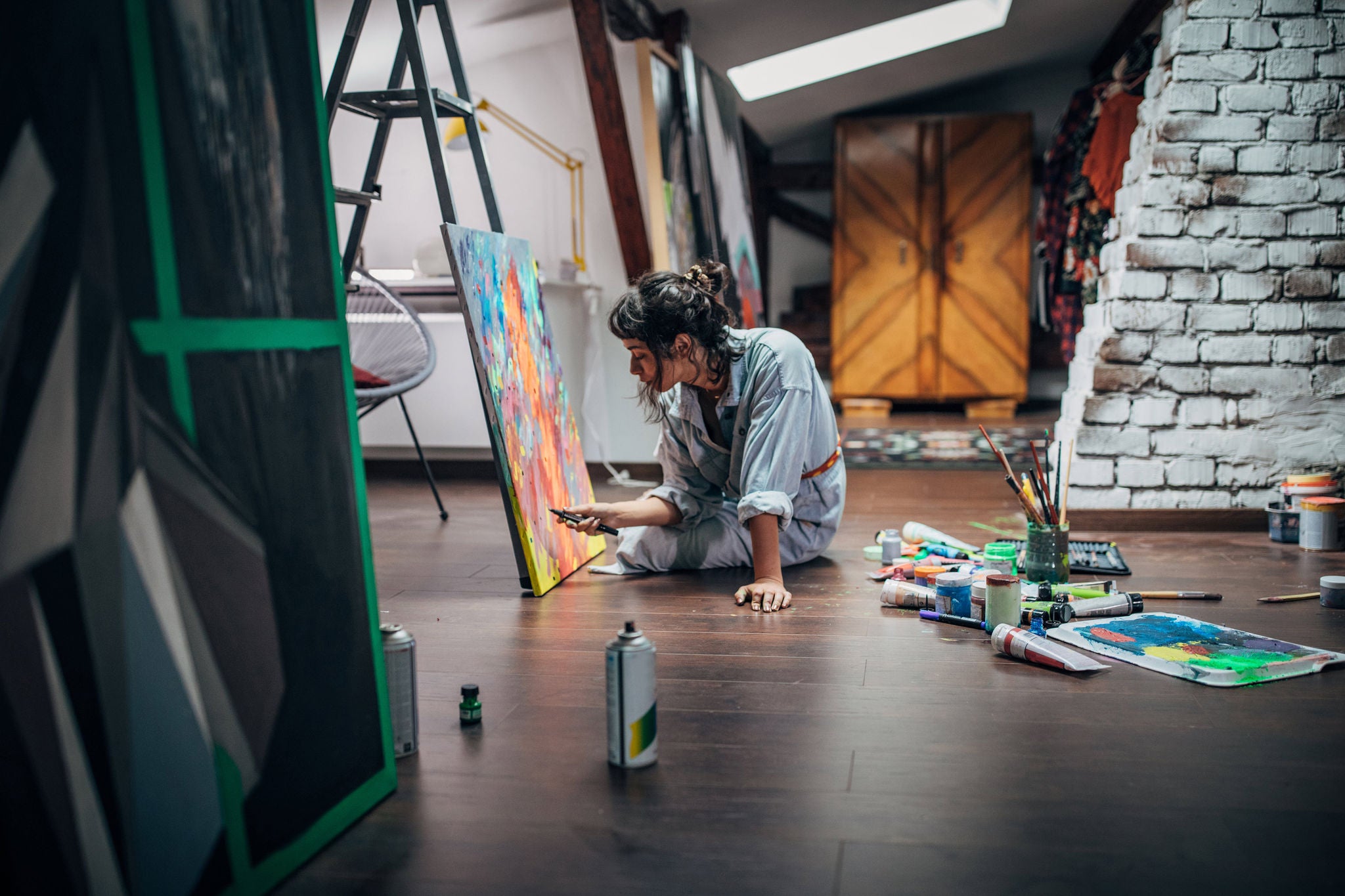 Women painting on canvas