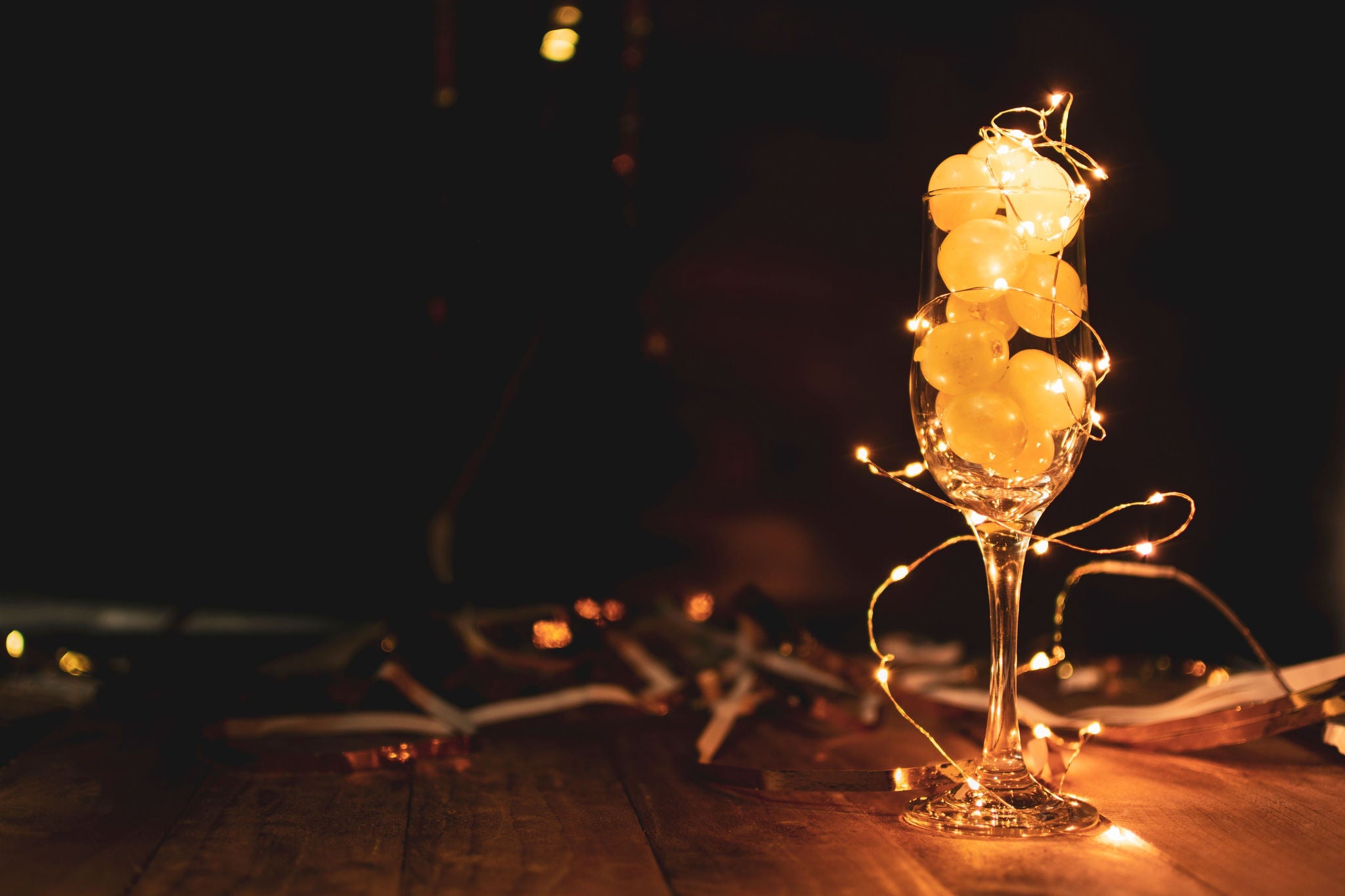 grapes in glass with string lights