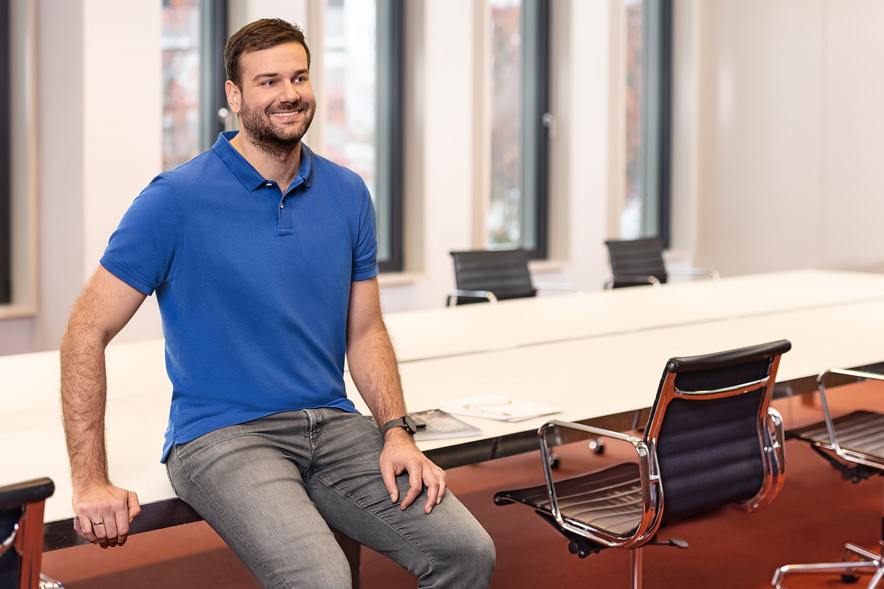 man sitting on a office conference table