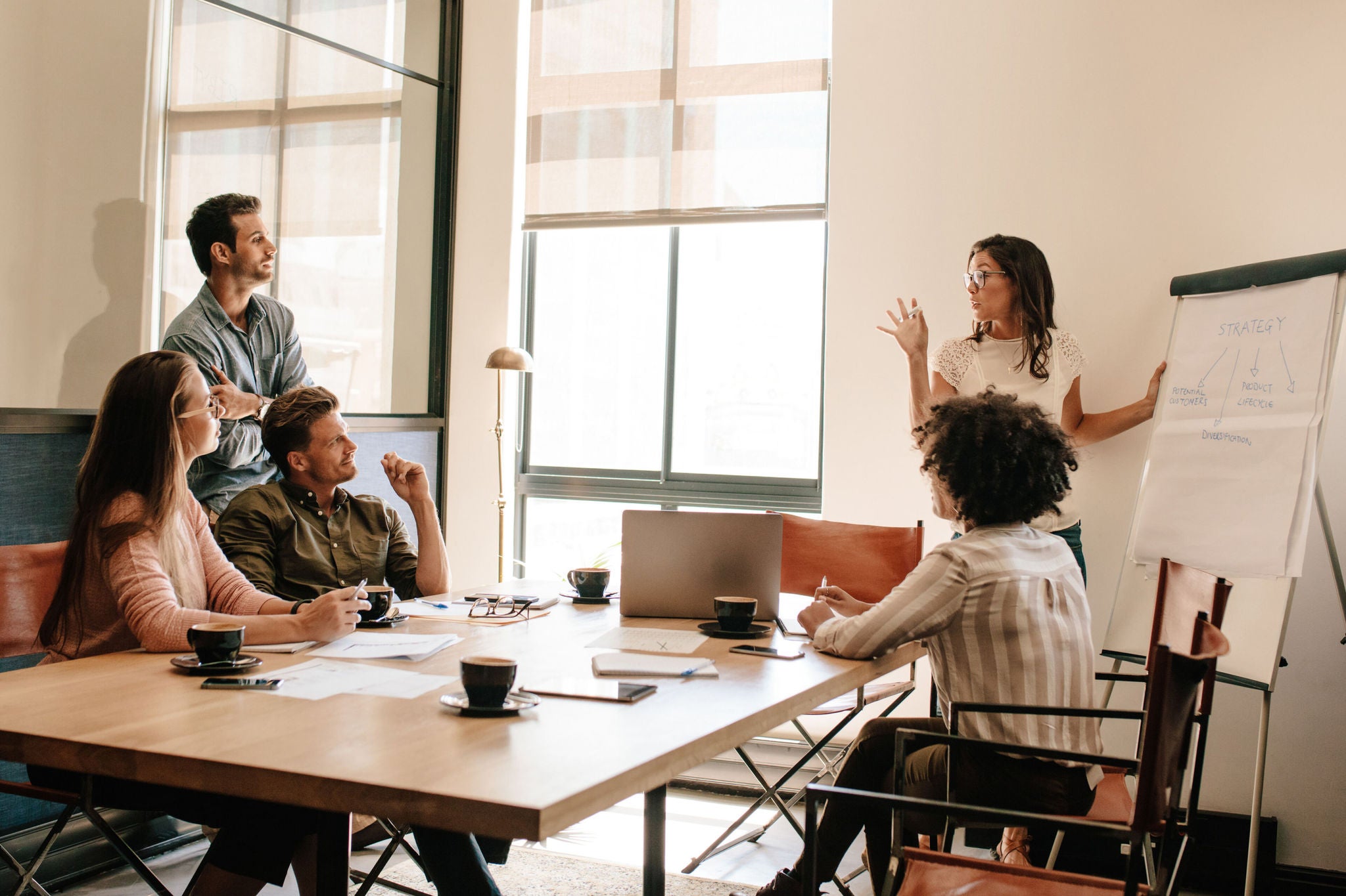 group of people discussing their workspace