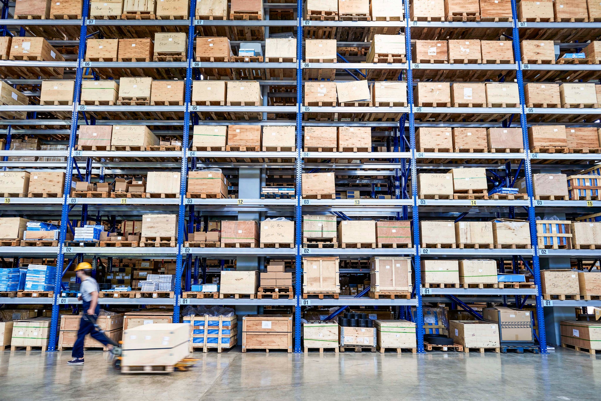 Cardboard boxes on shelves in warehouse. Storhouse.