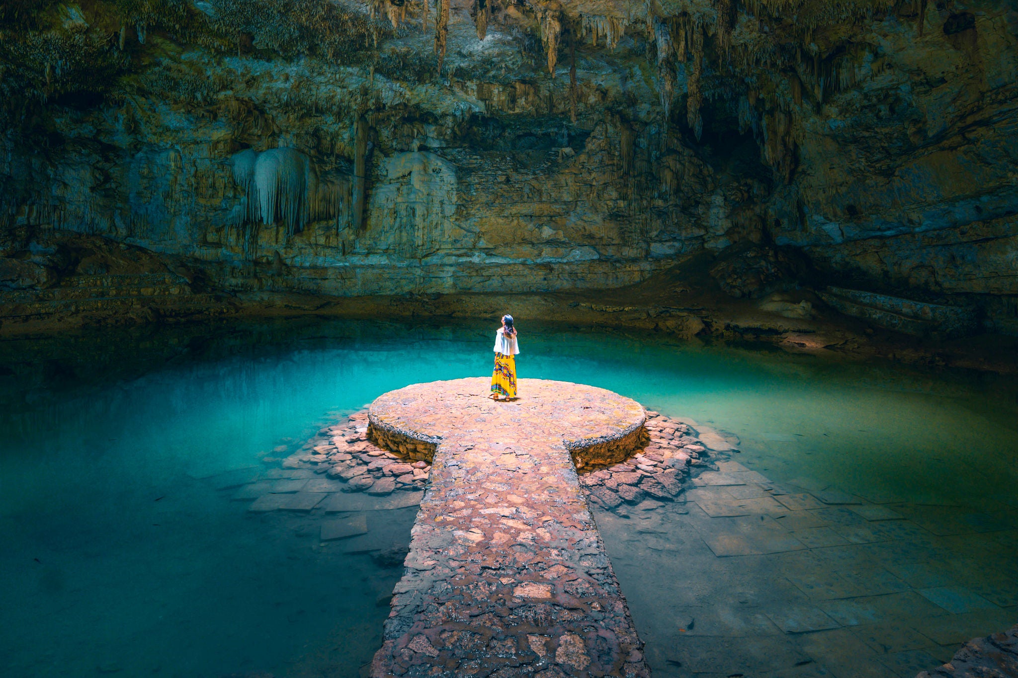 Woman alone in a cenote, Mexico