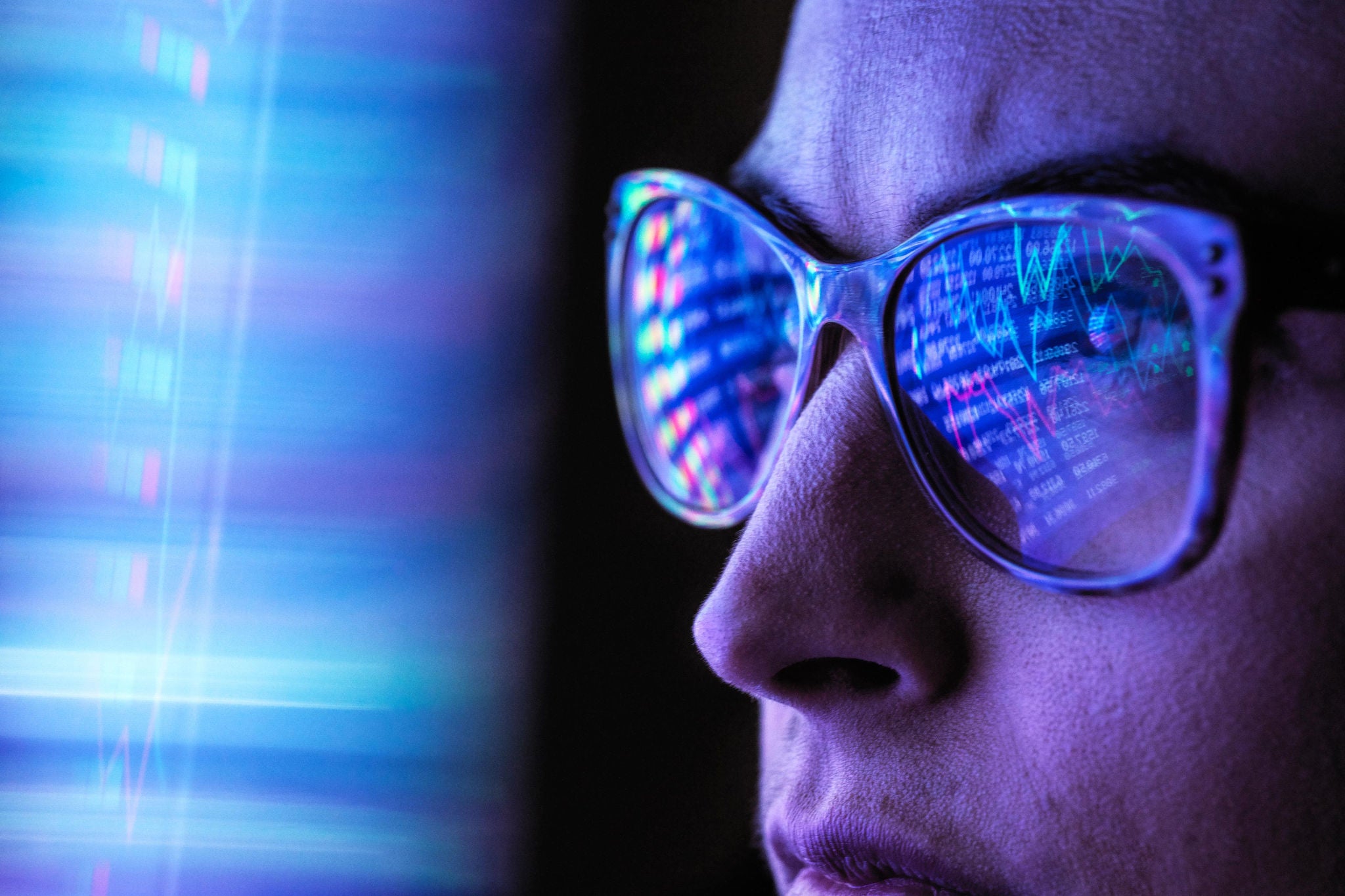 Female Analyst Viewing Financial Market Data On A Screen