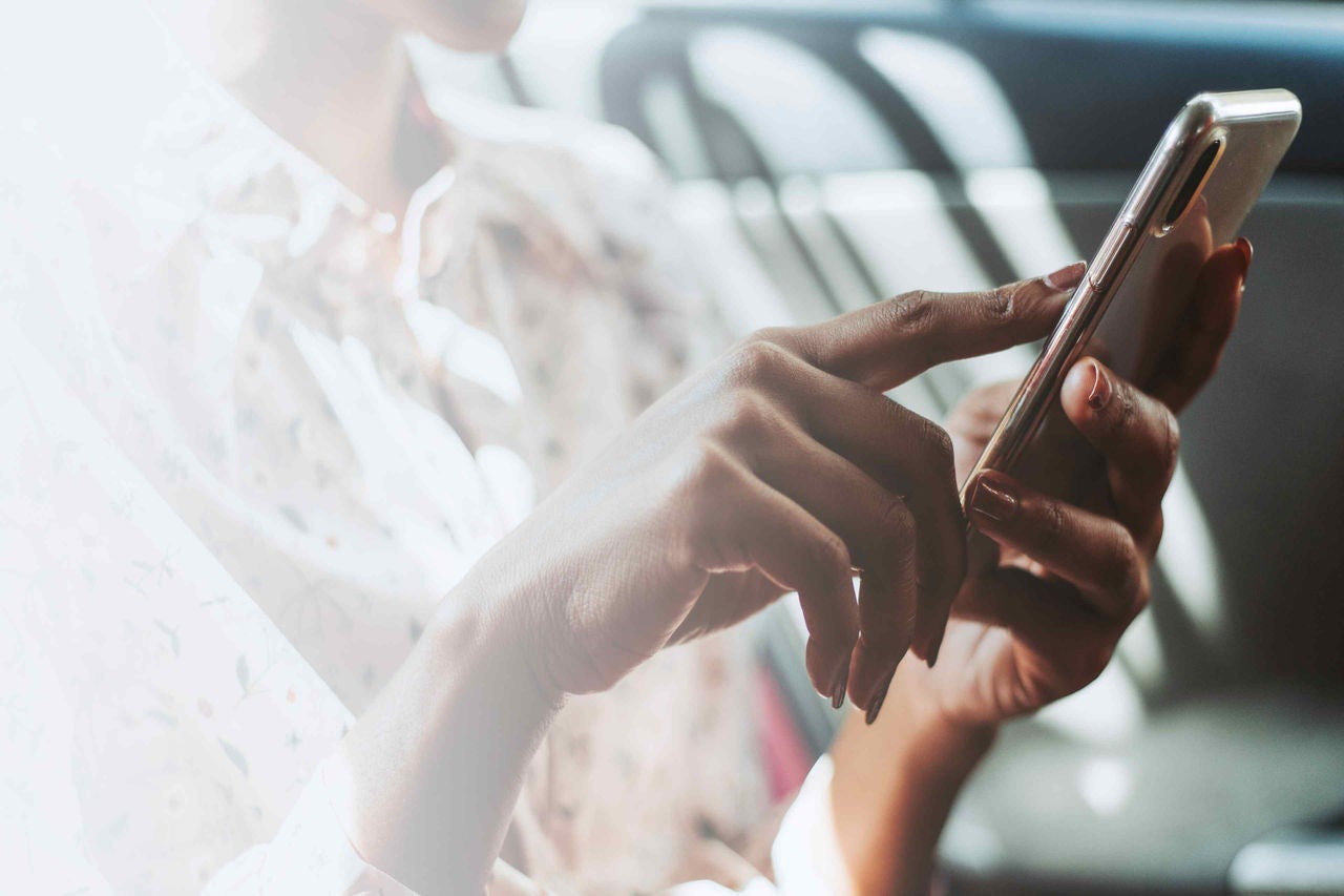 Women is holding a mobile in her hands 