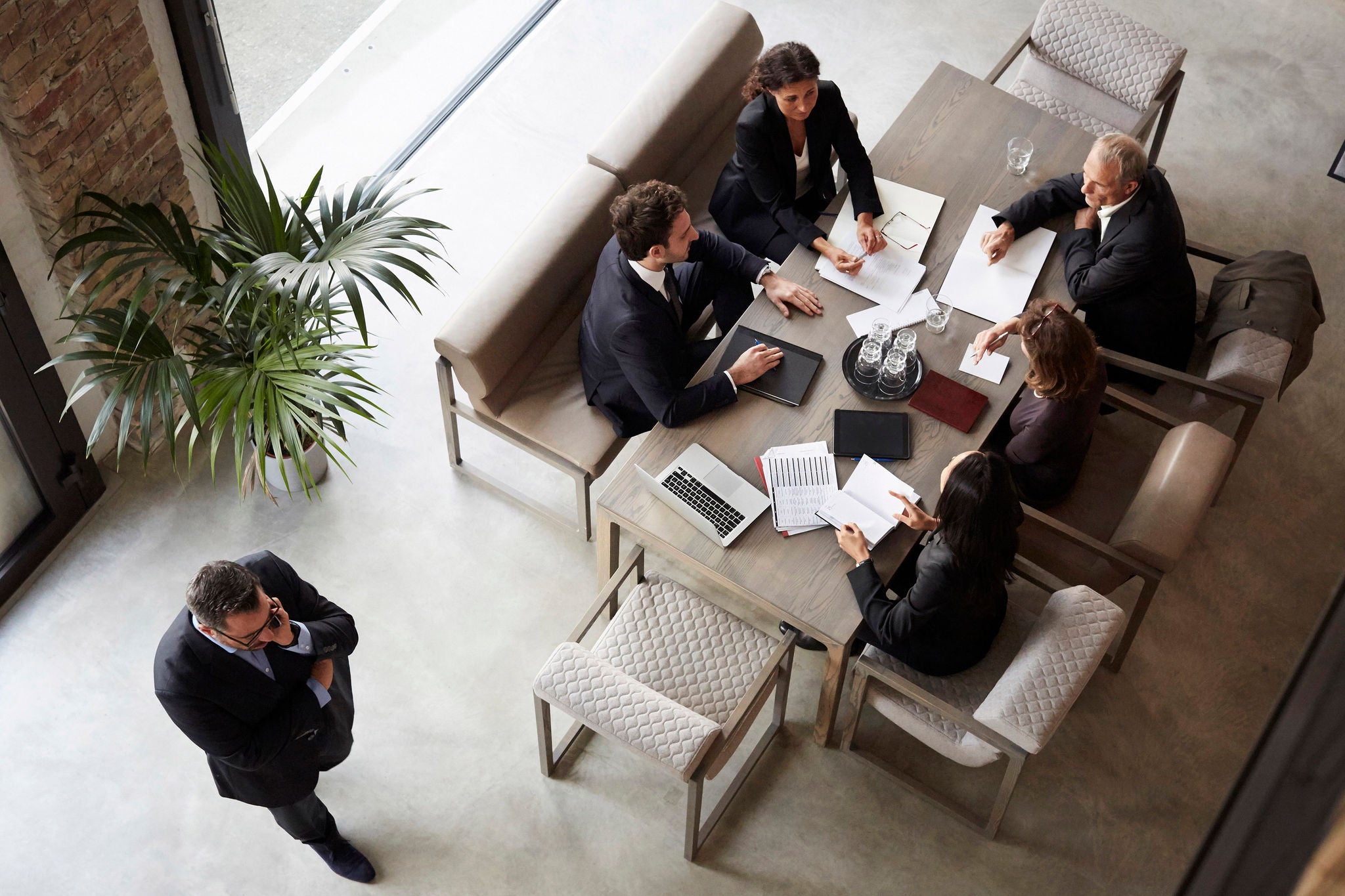 Team of financial advisors planning with business coworkers during meeting at law firm