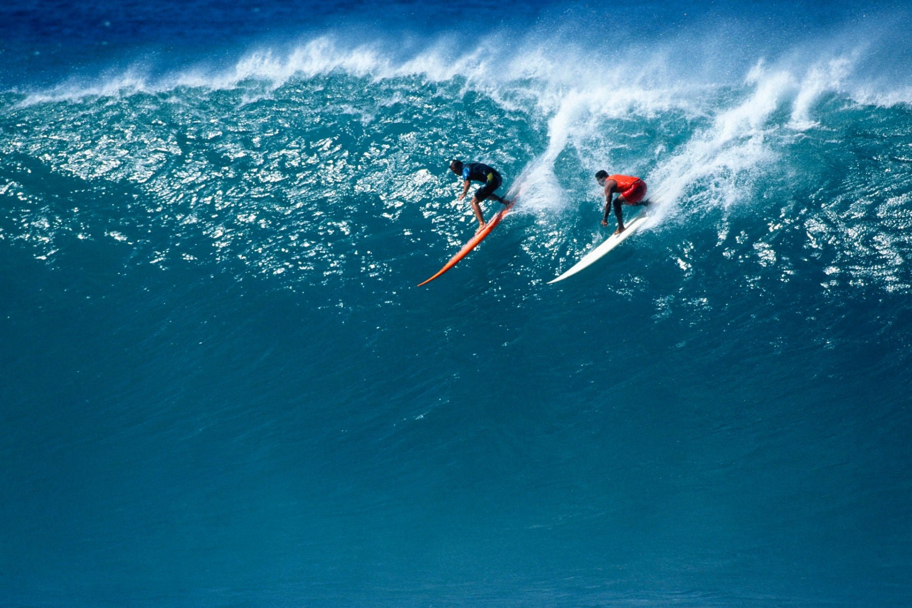 ey-two-surfers-riding-a-huge-wave