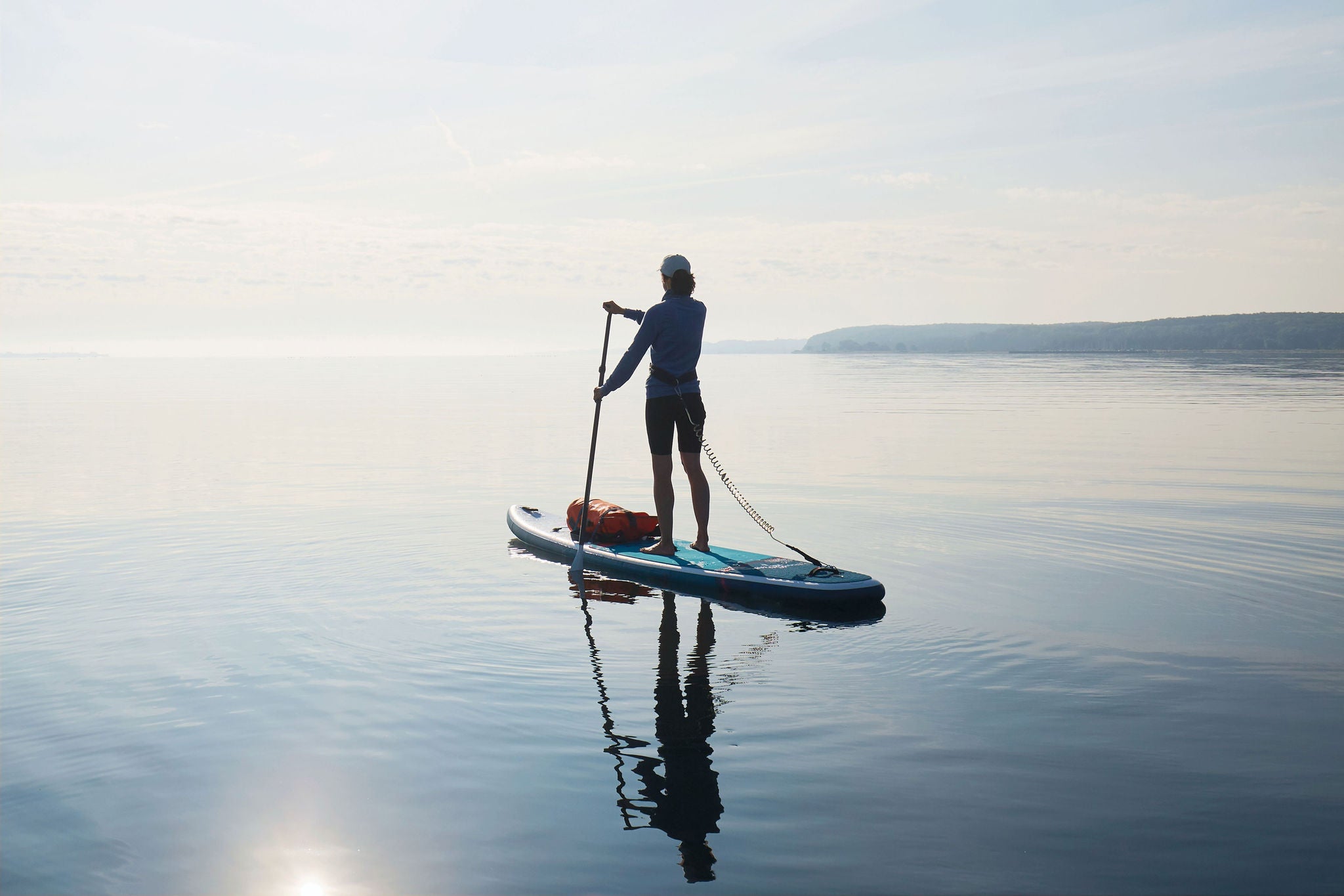 Woman paddleboard lake