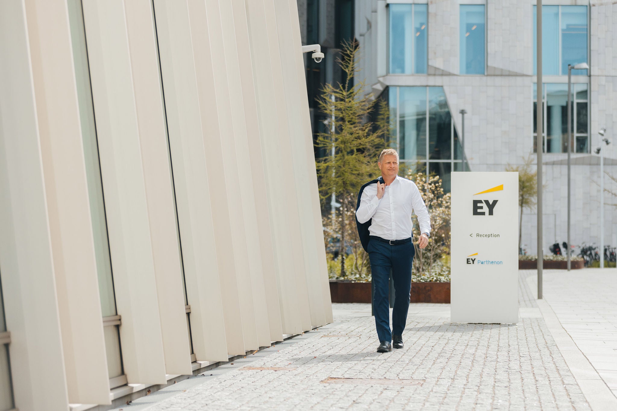 Søren Smedegaard Hvid walks outside EY's office in Copenhagen