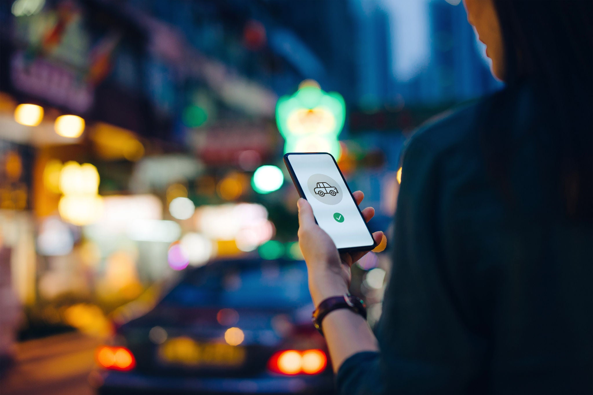 Asian woman using mobile app on smartphone