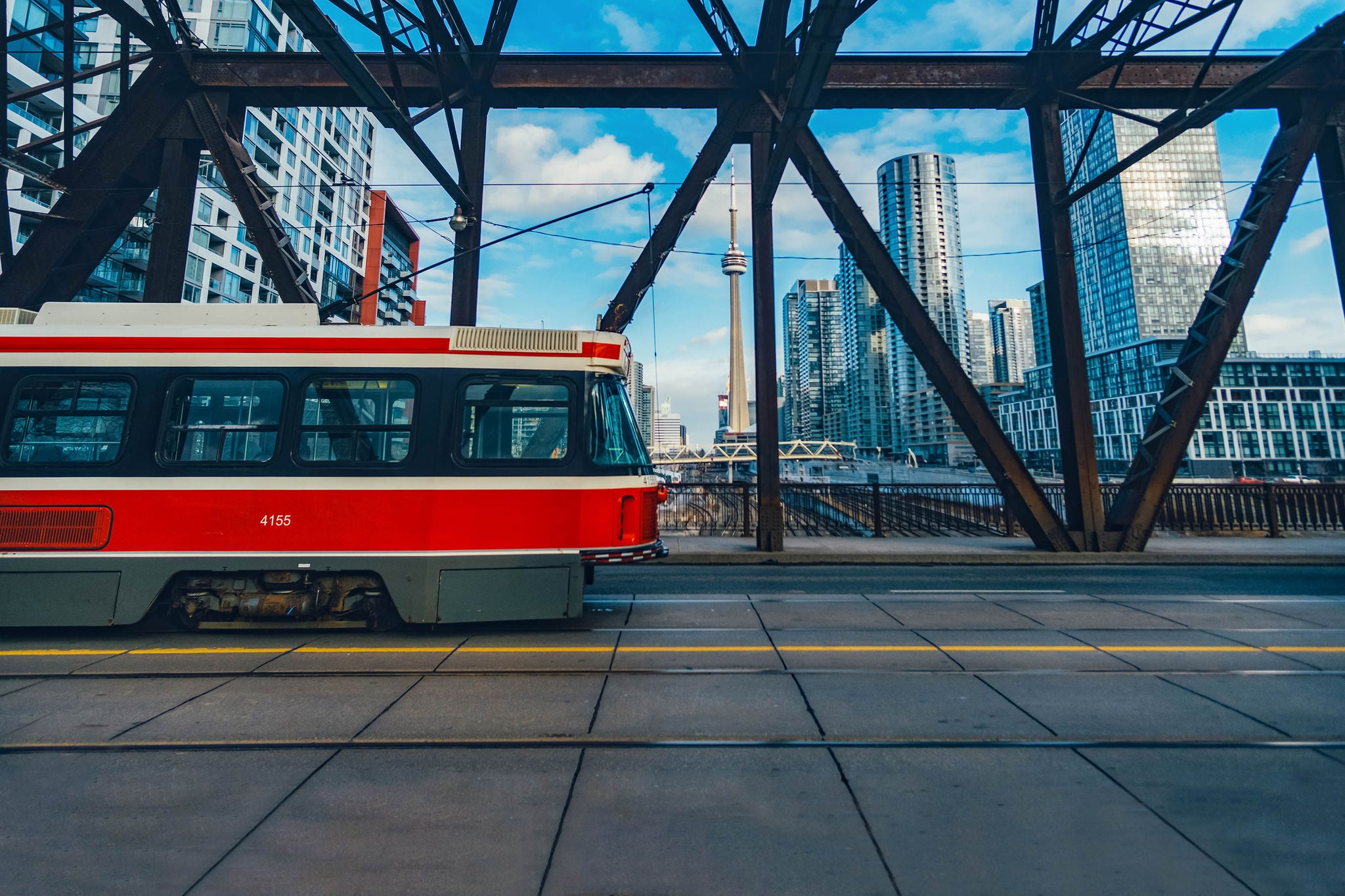 ey-tram-going-past-the-cn-tower-in-toronto