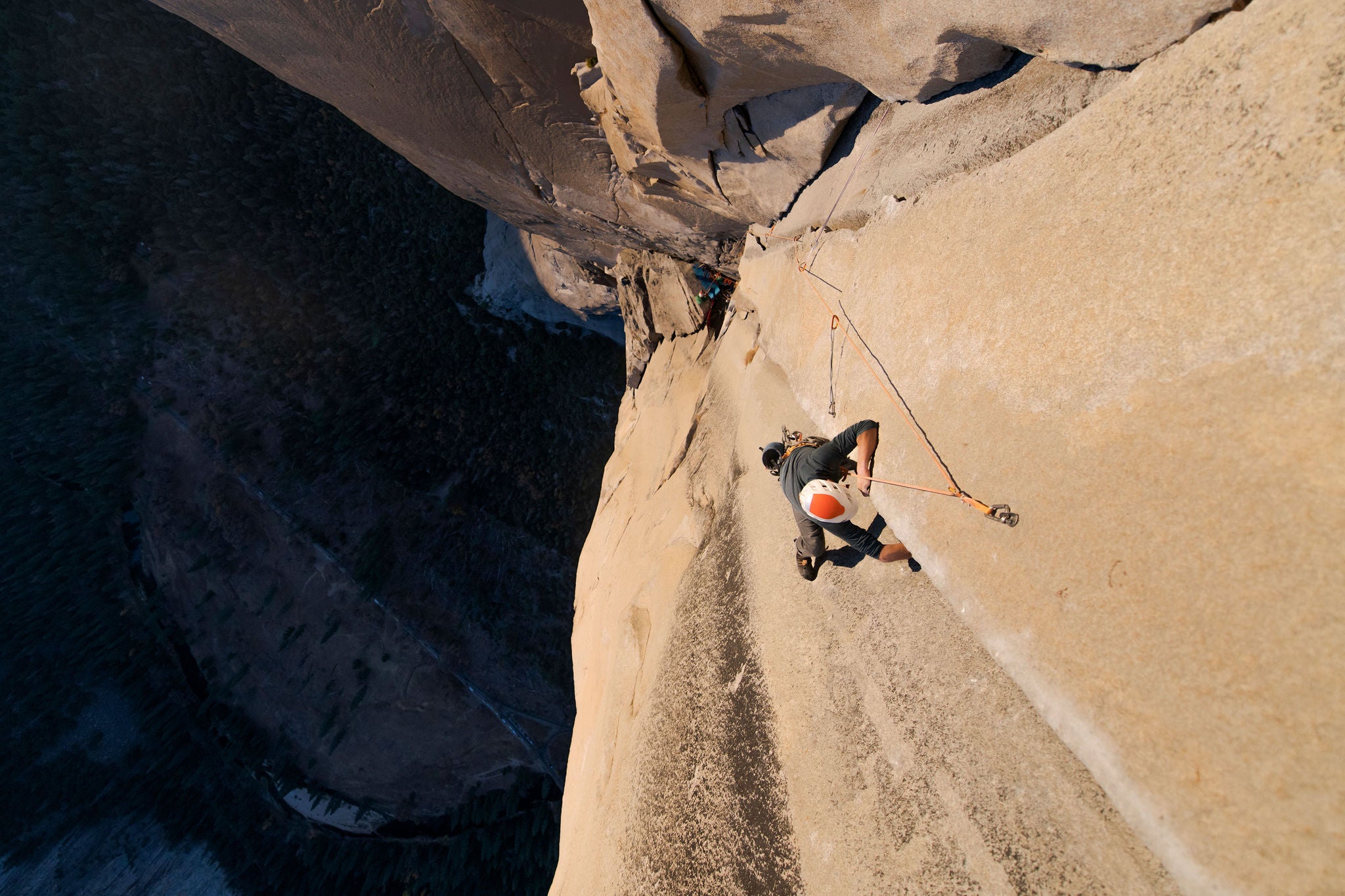 Two men climbing a big wall rock