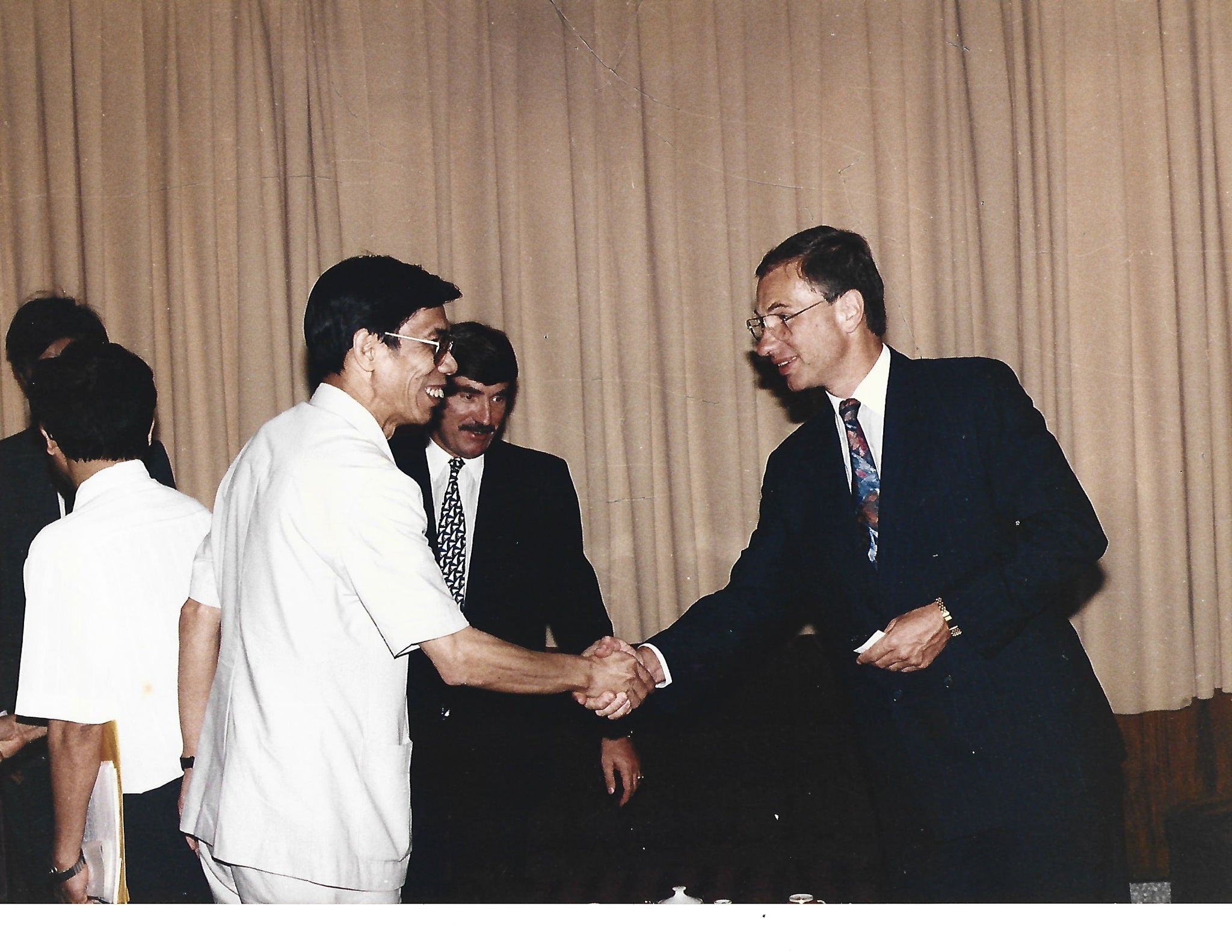 Businessmen shaking hands each other