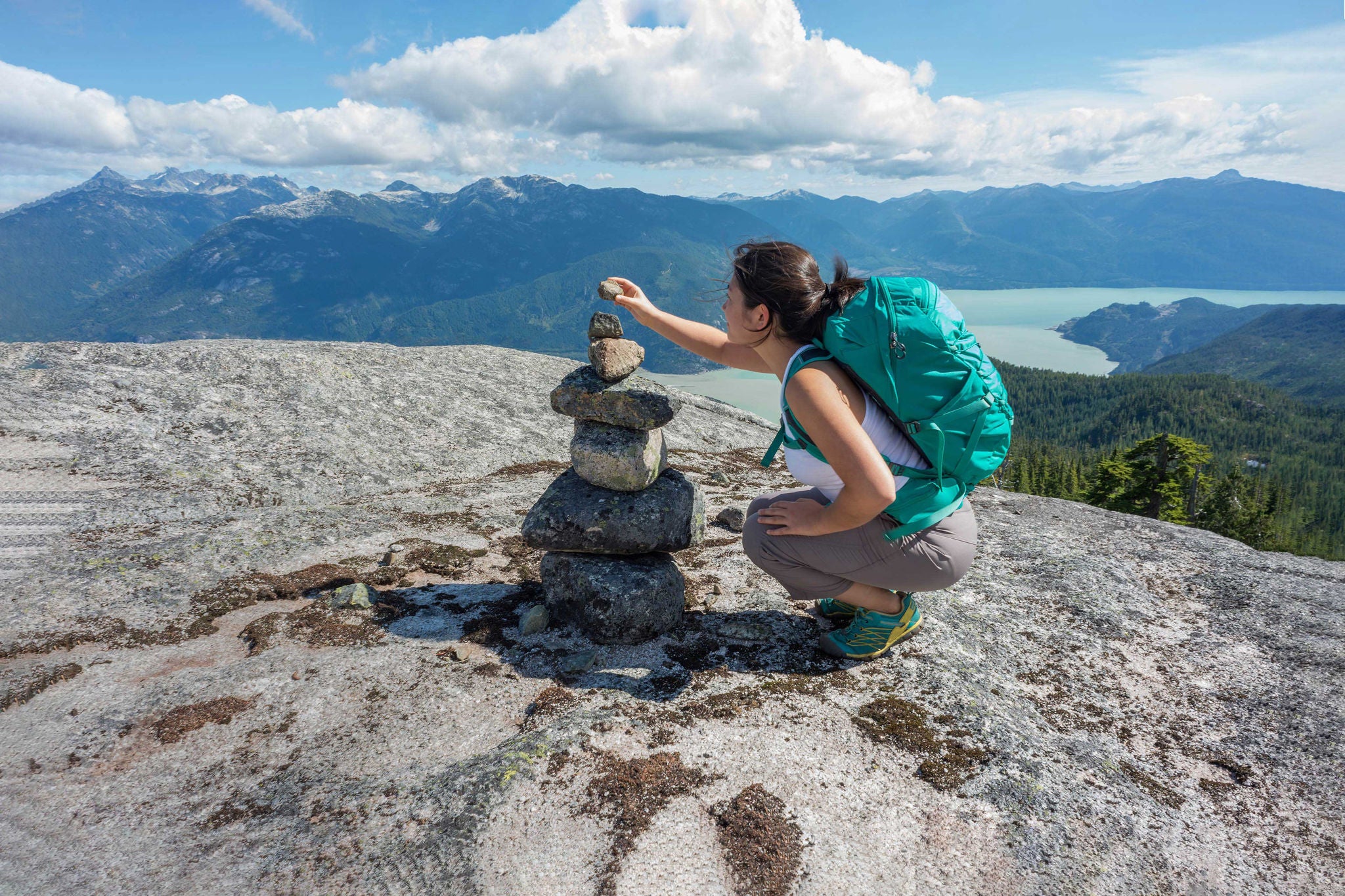 Woman stacking rocks