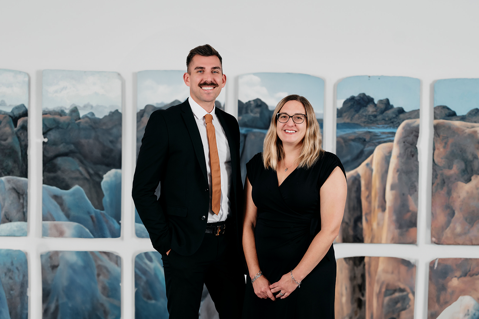 Photographs of promoted EY leaders - Christian Robinson and Nicoline Armatas 