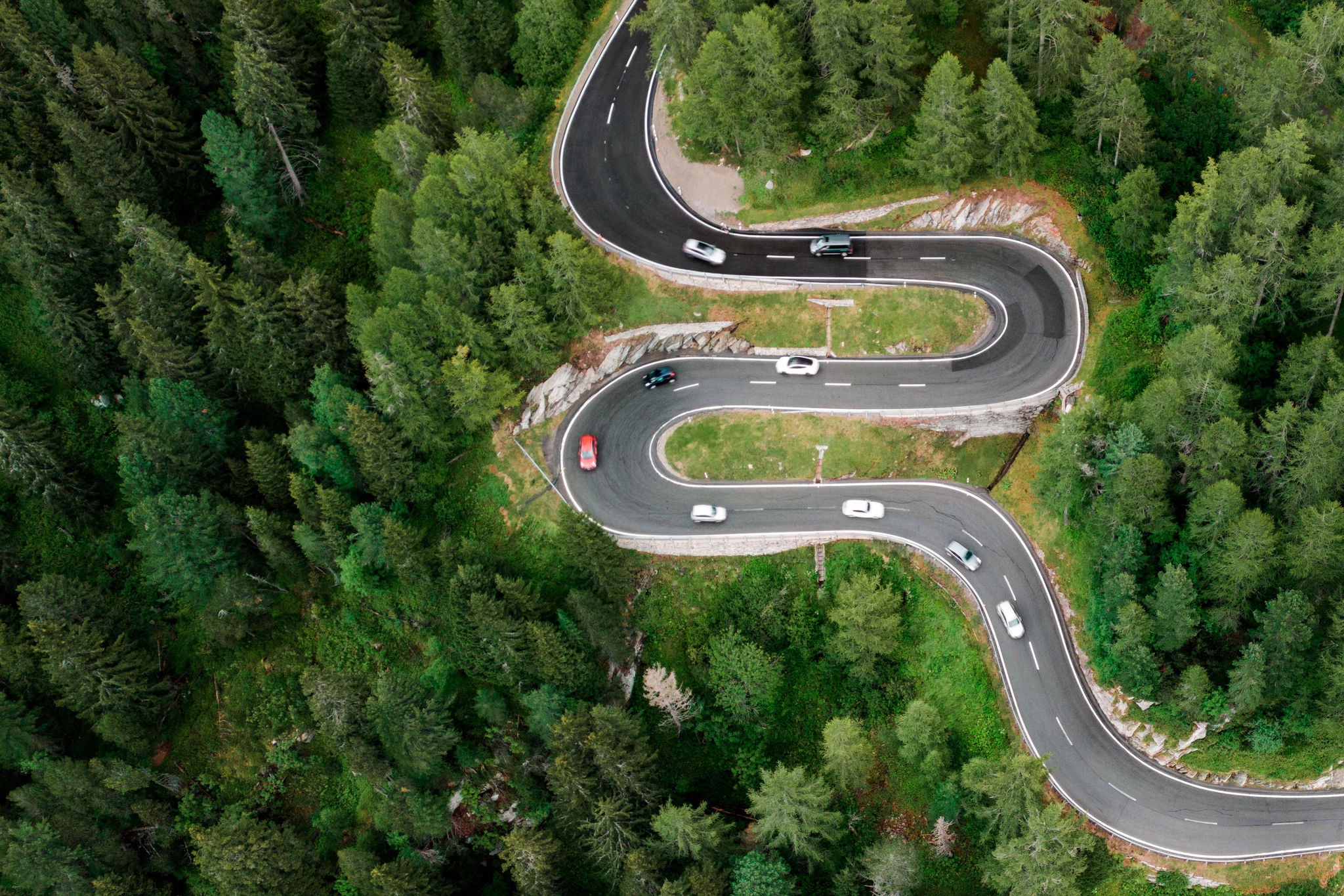 Aerial view of car on the mountain road in Switzerland