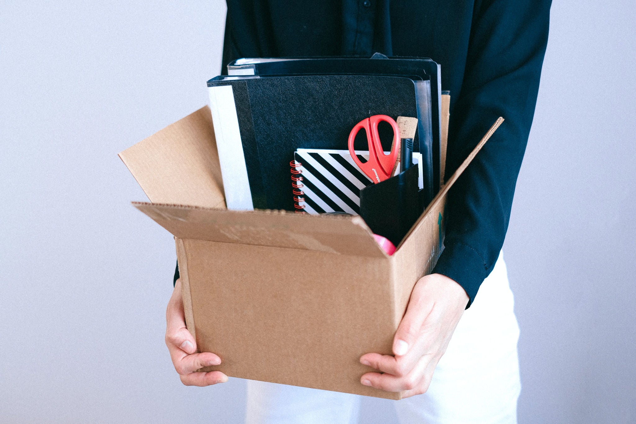 Man holding a box of books