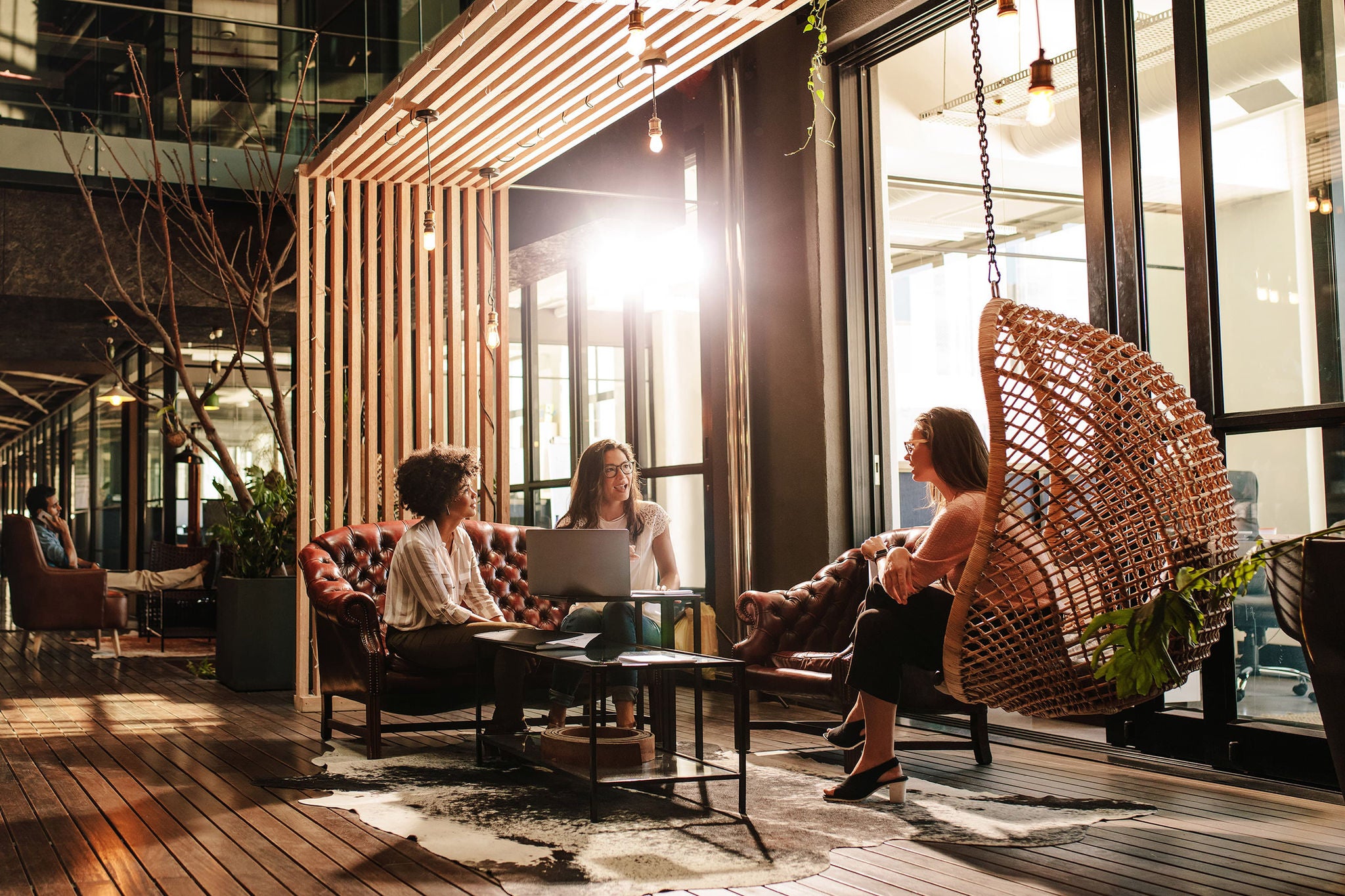 Three-women-having-a-conversation-in-breakout-area