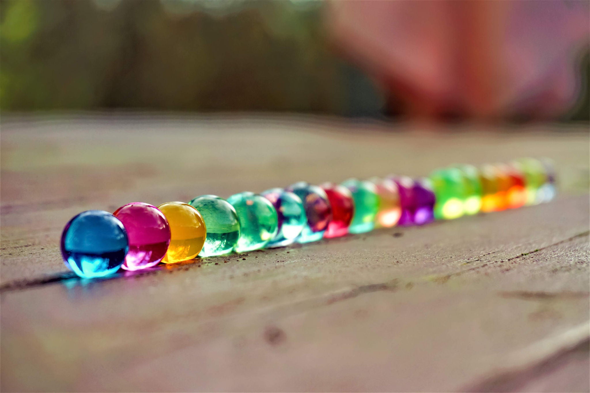 line of colorful glass marbles 