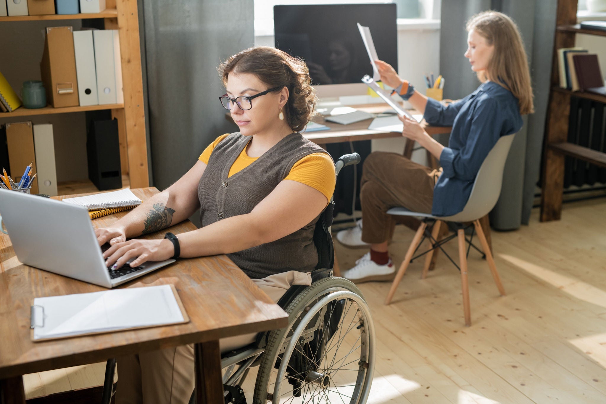 Two ladies working in the office