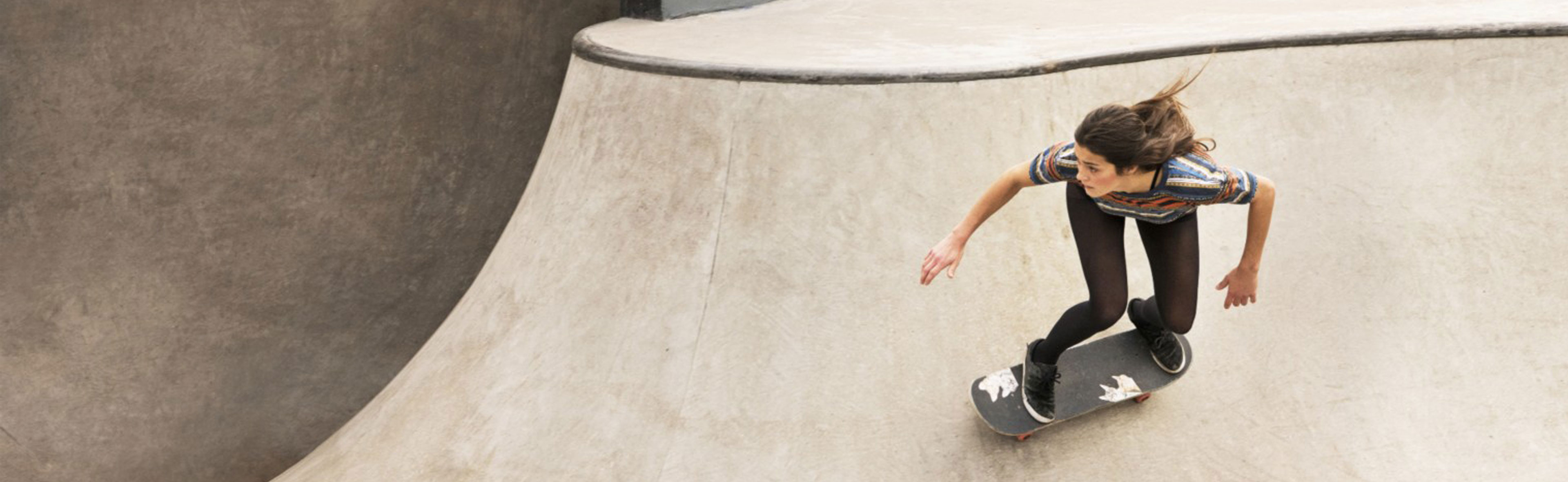 Women playing with skating board