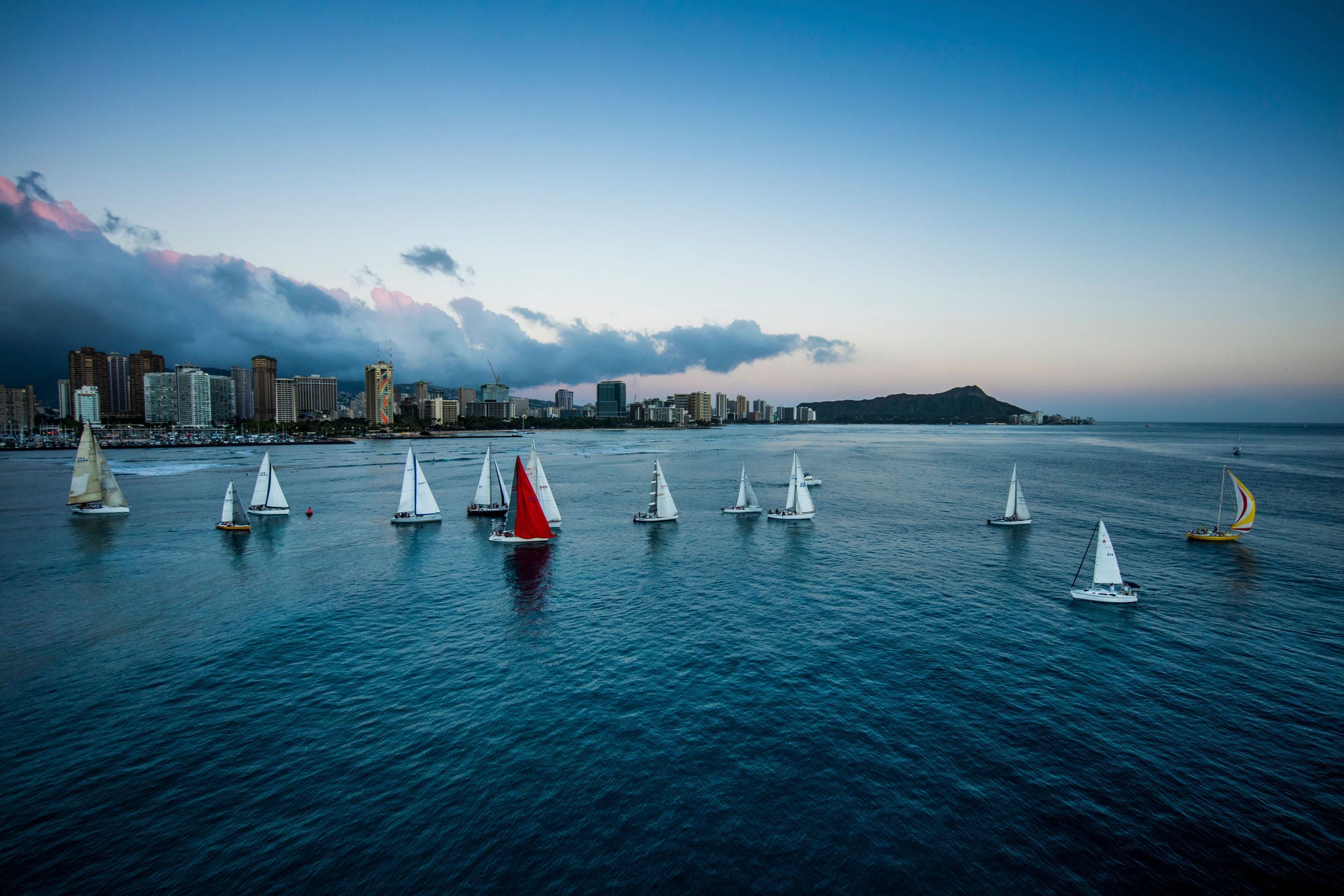 Aerial view of sailboat race lineup