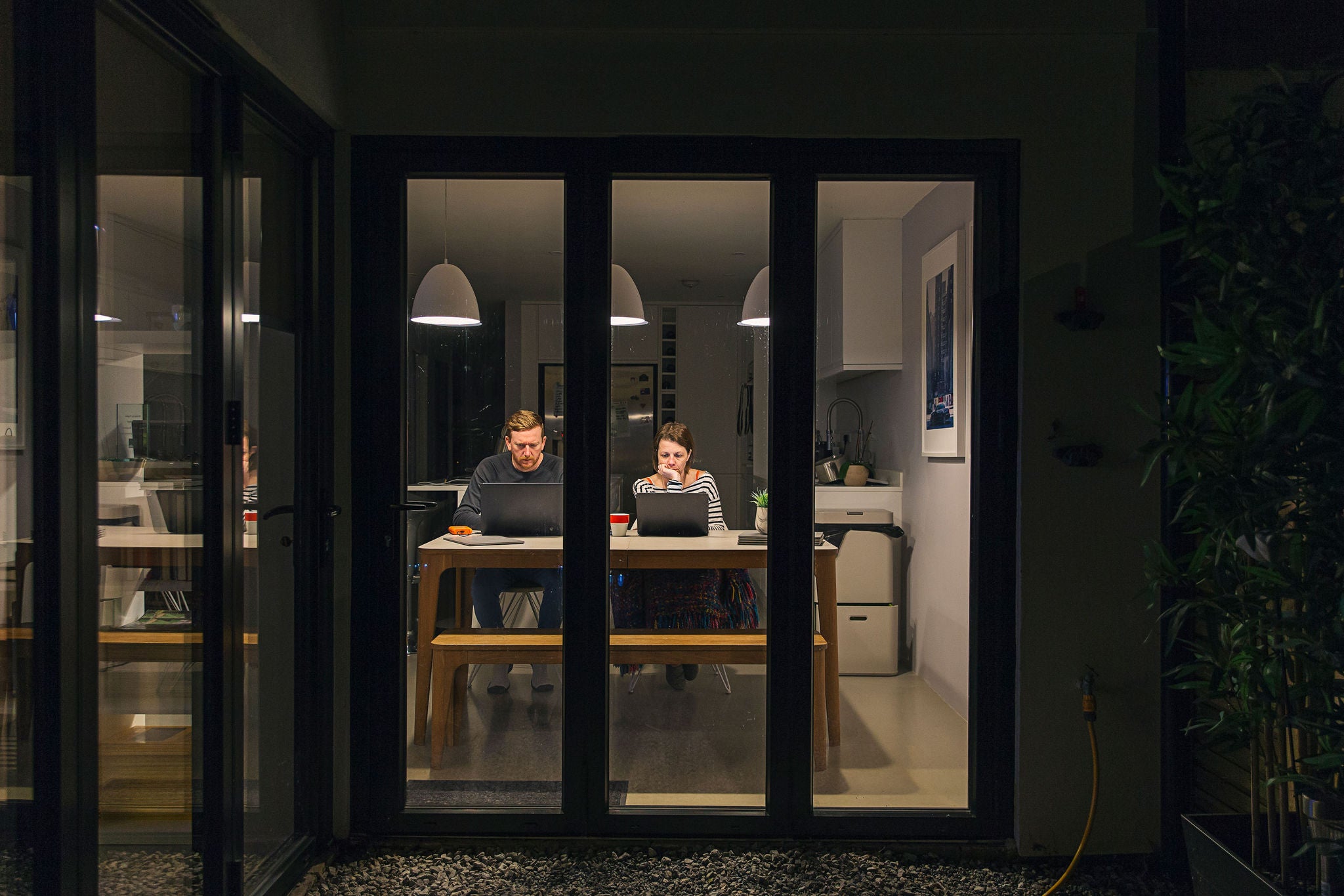 Couple working from home at night