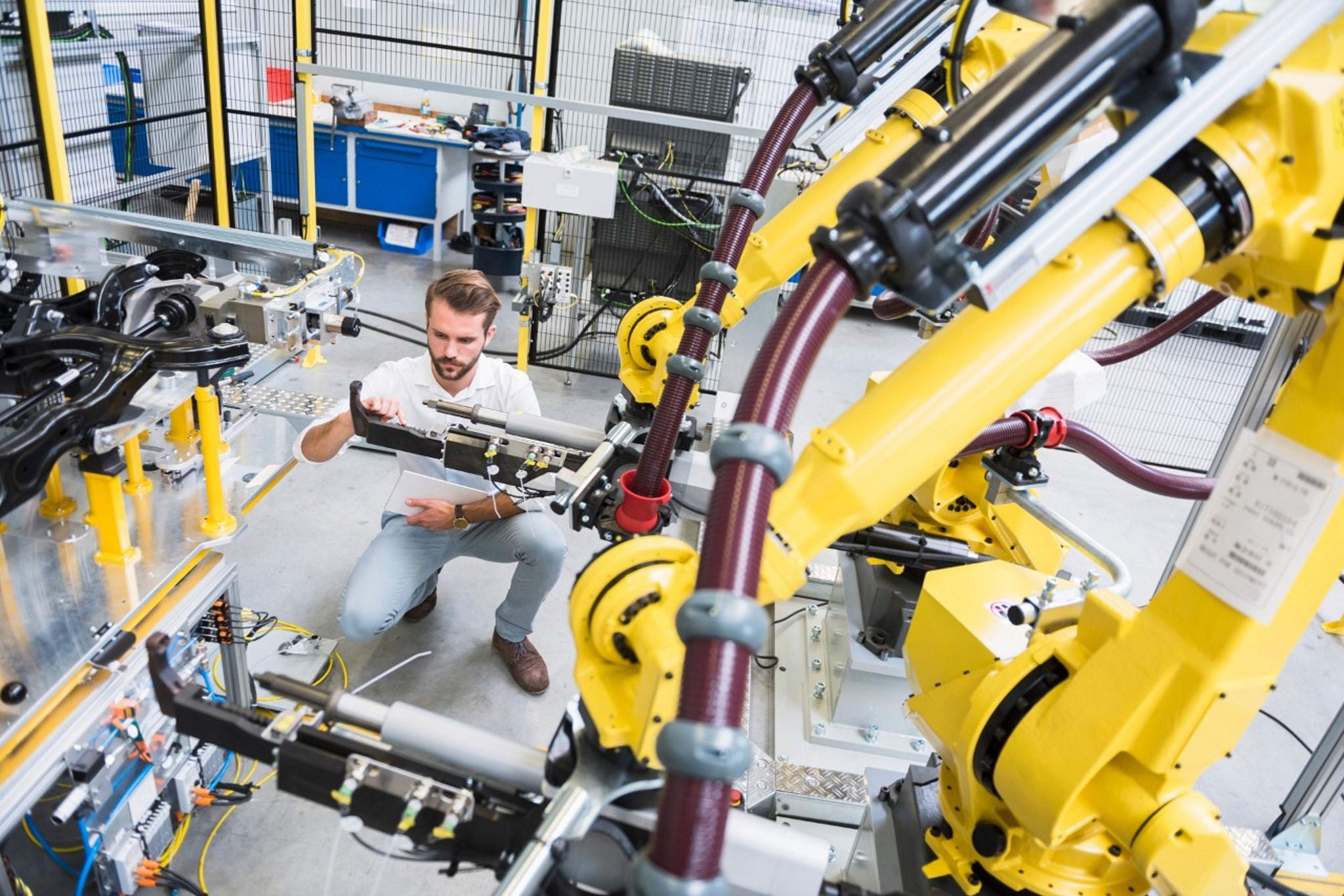 manufacturer in factory overseeing production