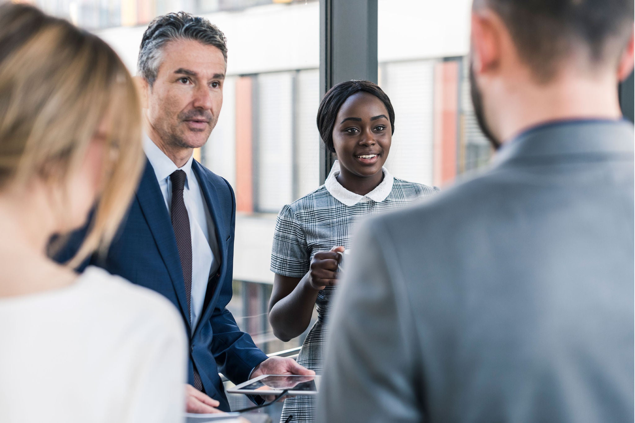 a group of employees having a discussion