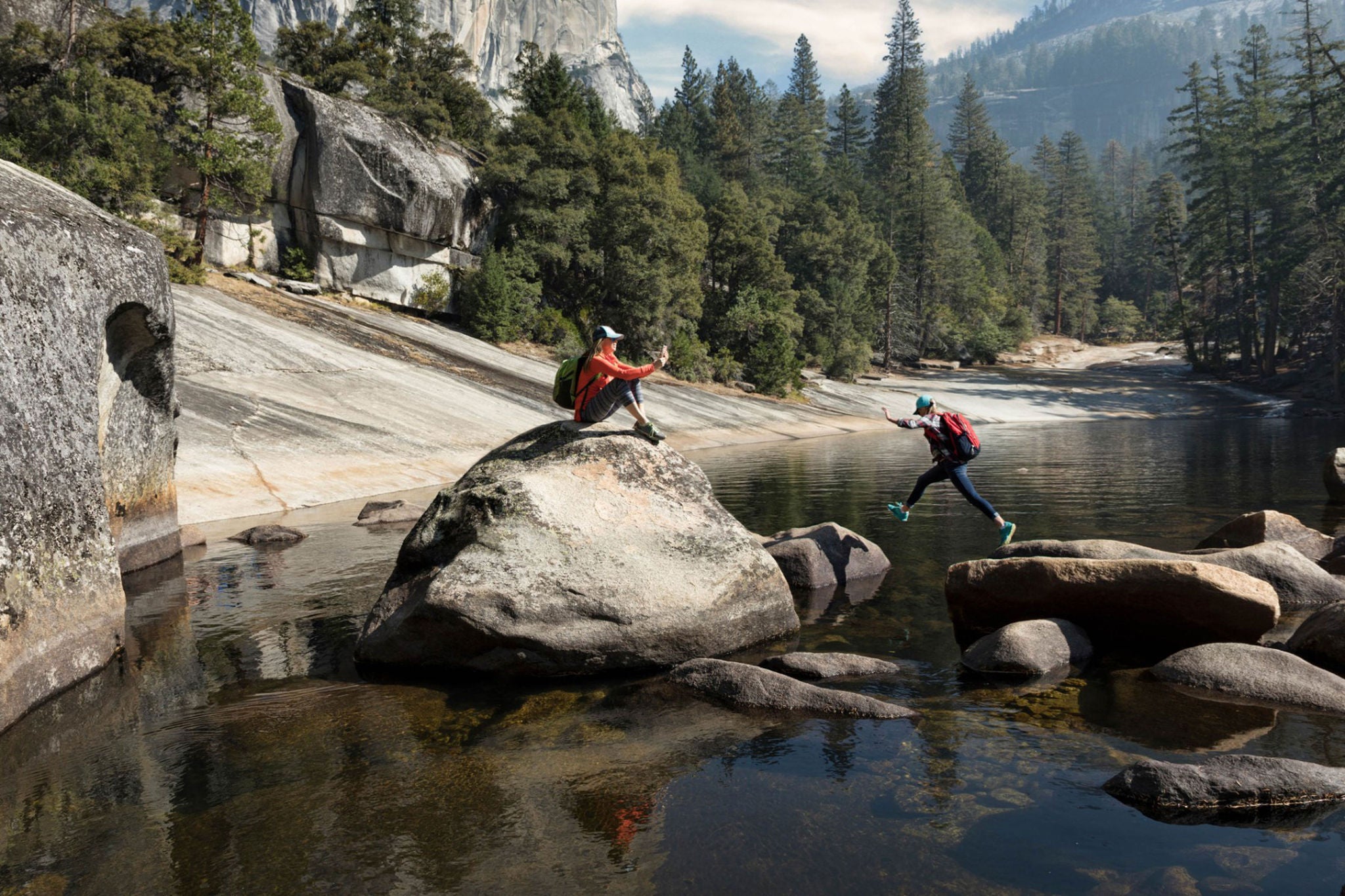 mother photographing daughter by emerald pool above vernal falls yosemite