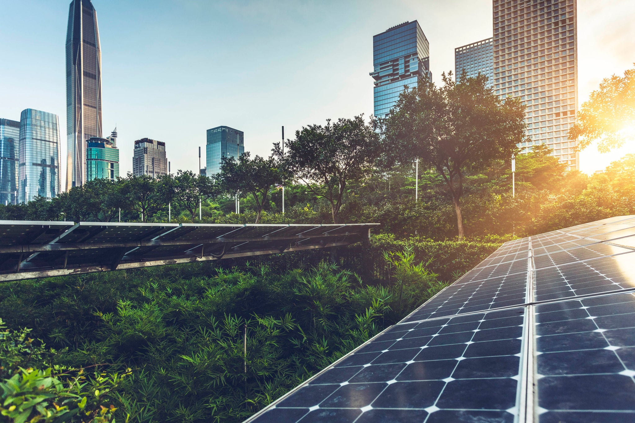 Roof top solar installation with shenzhen downtown skyline view as background,China.