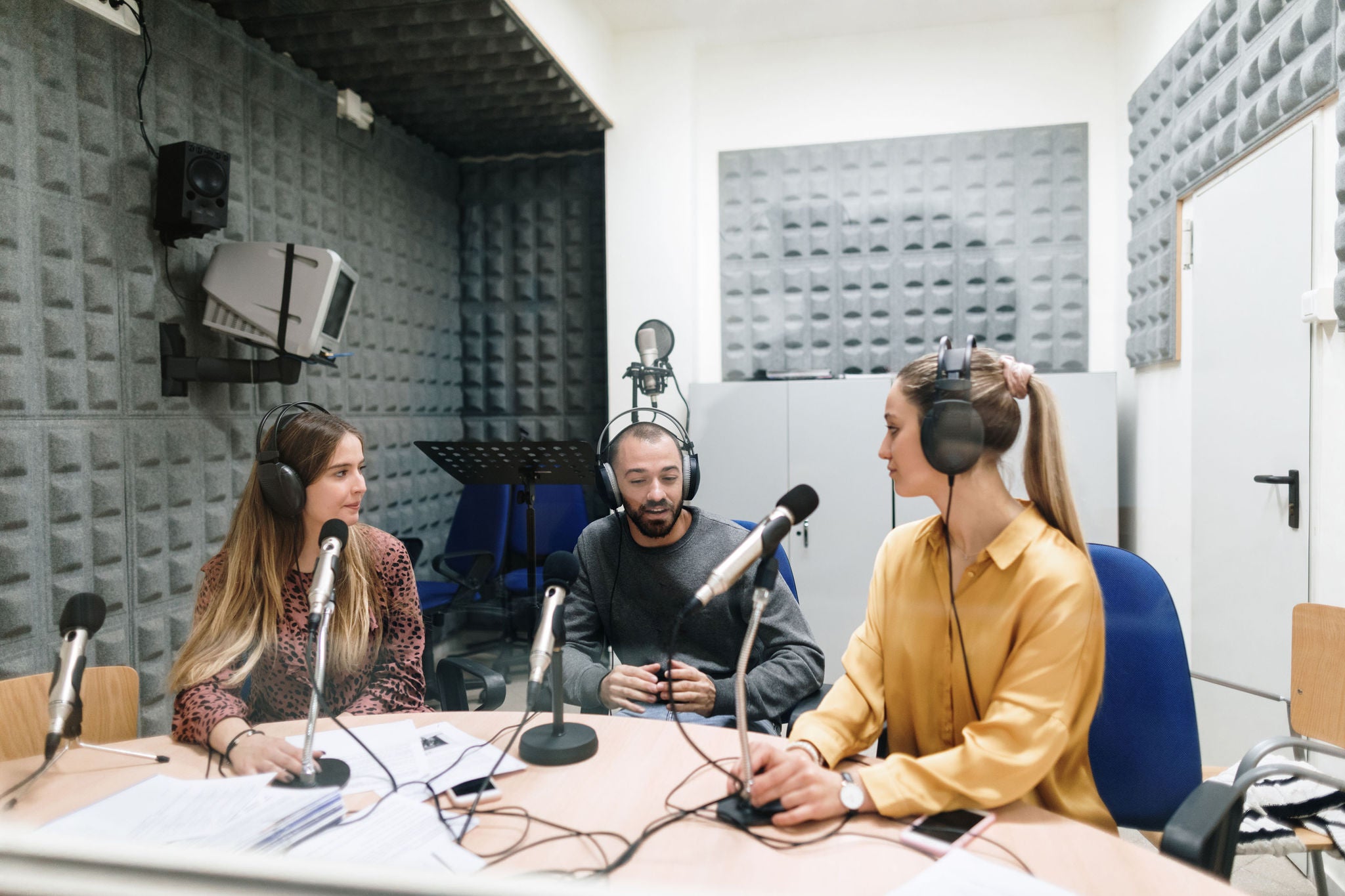 Group of people conducting a radio interview