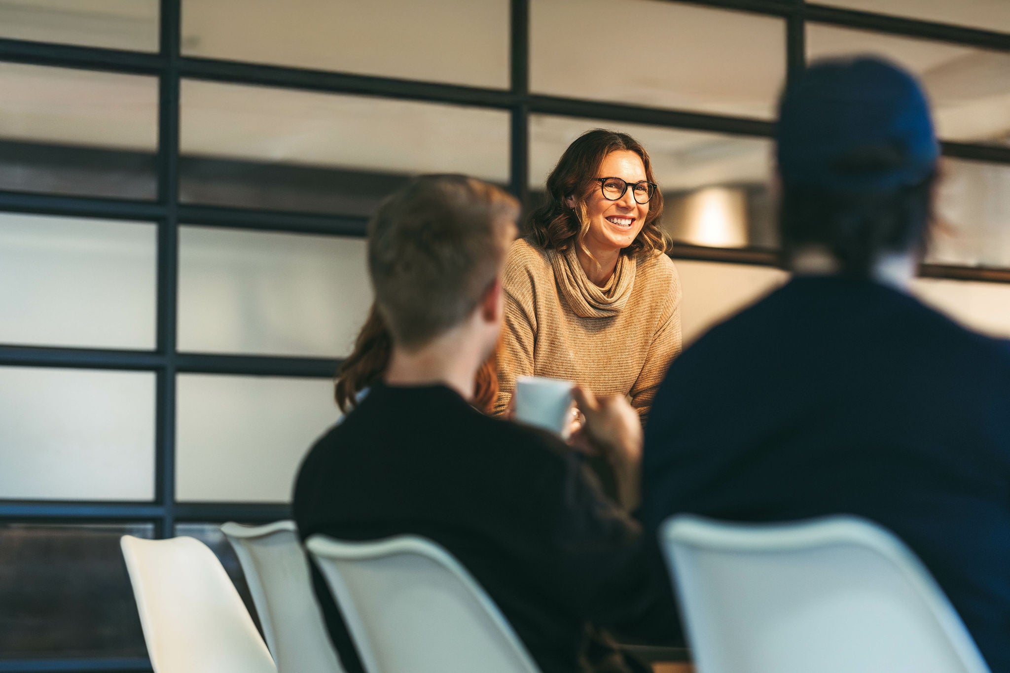  confident woman leads the team presenting ideas