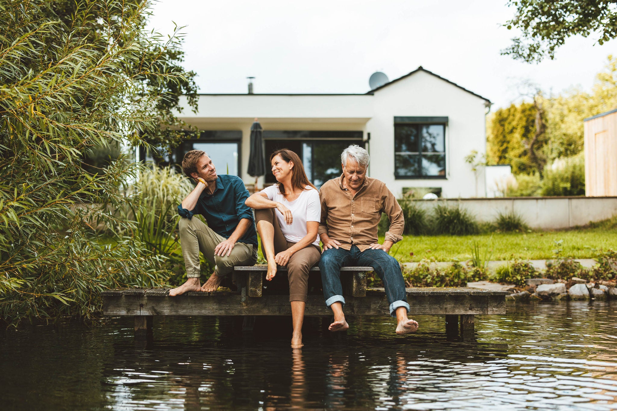 Family sitting on a jetty