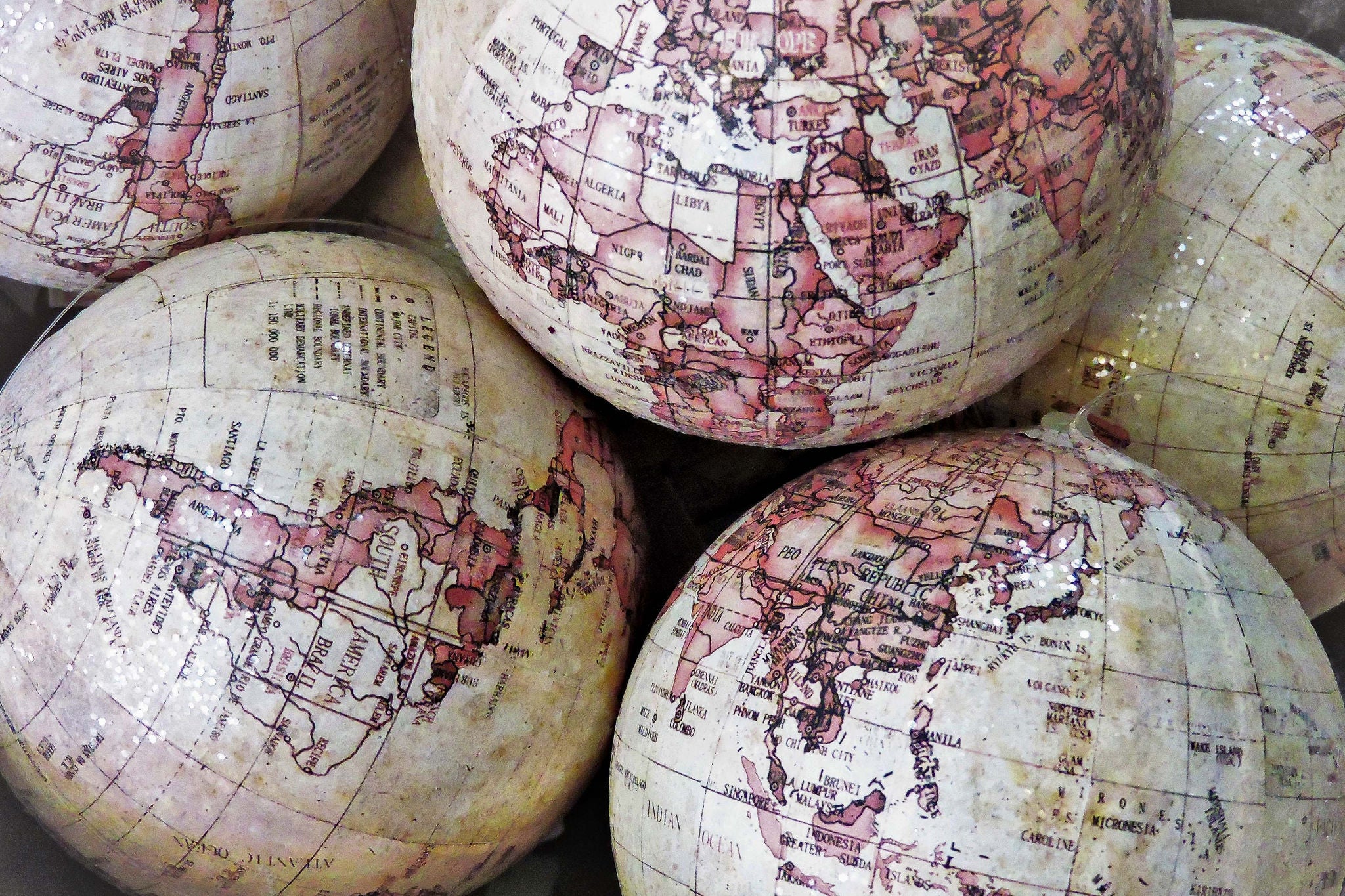 pile of damaged globes in a shop