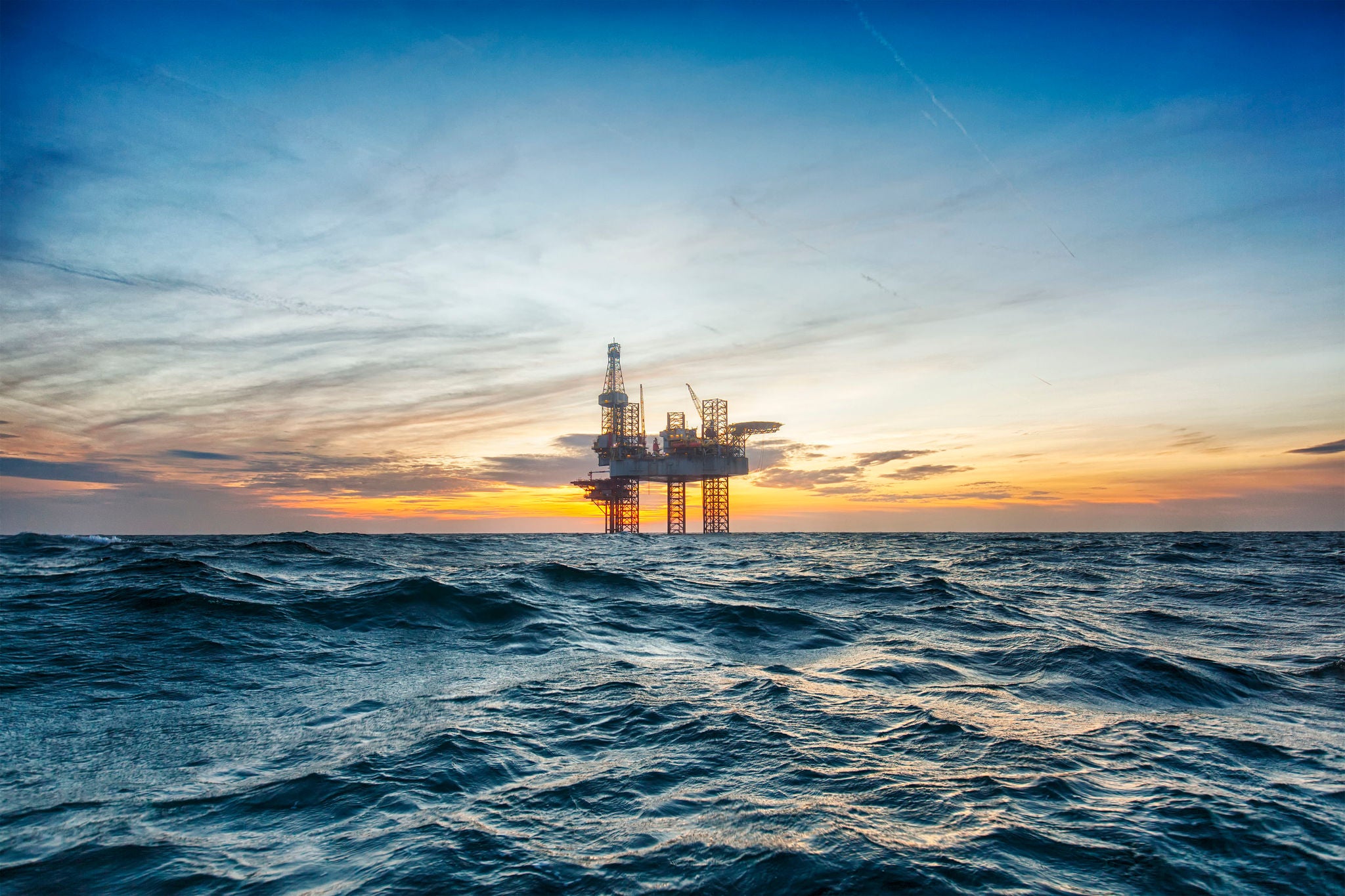 Offshore drilling rig at sunset