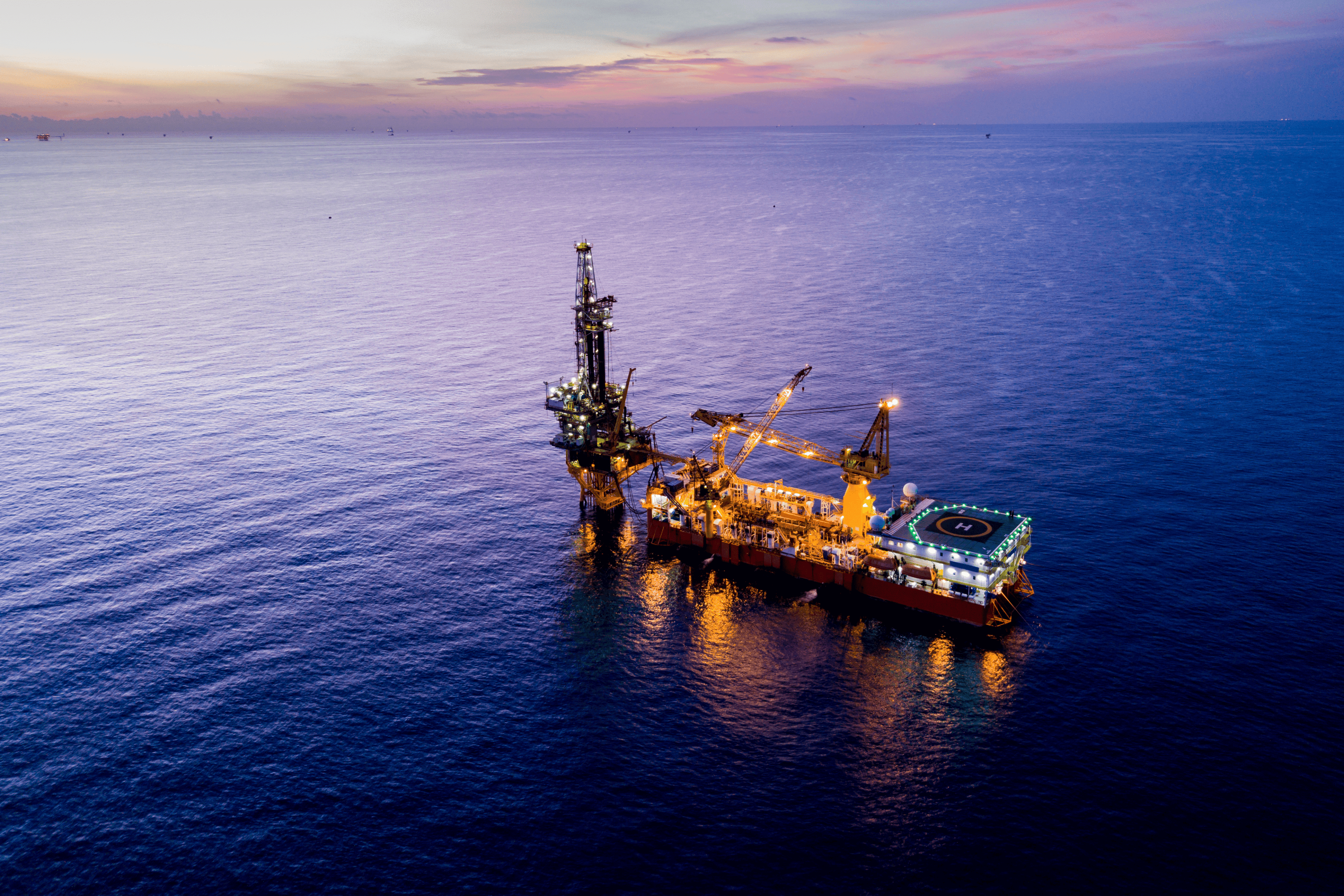 EY aerial view of tender drilling oil rig