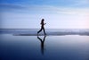 woman jogging on beach