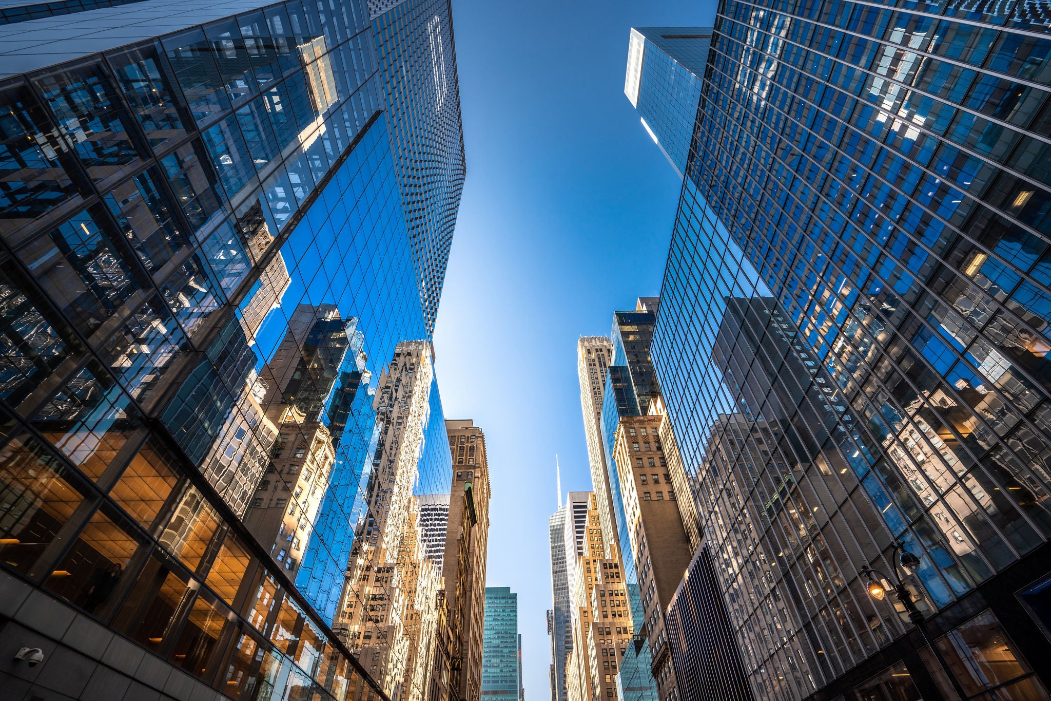 Futuristic skyscrapers in Midtown Manhattan on a sunny day.