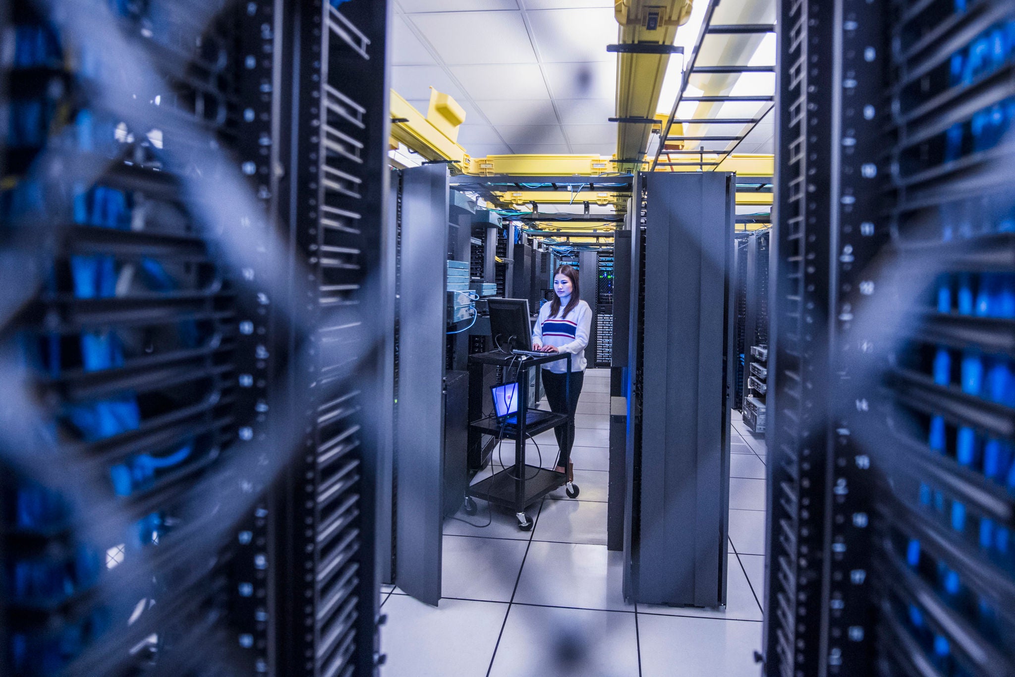 woman working at computer server room