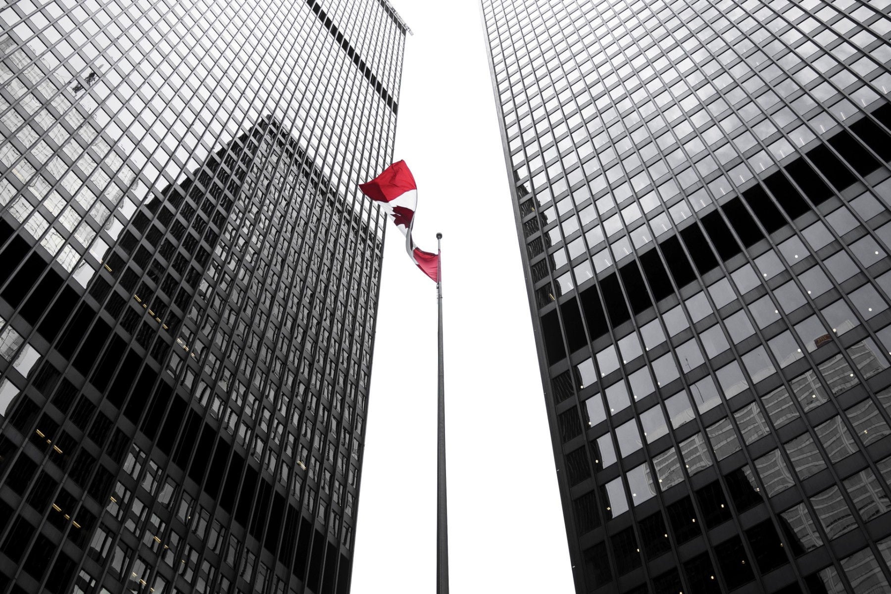  EY - Canada flag amongst office buildings