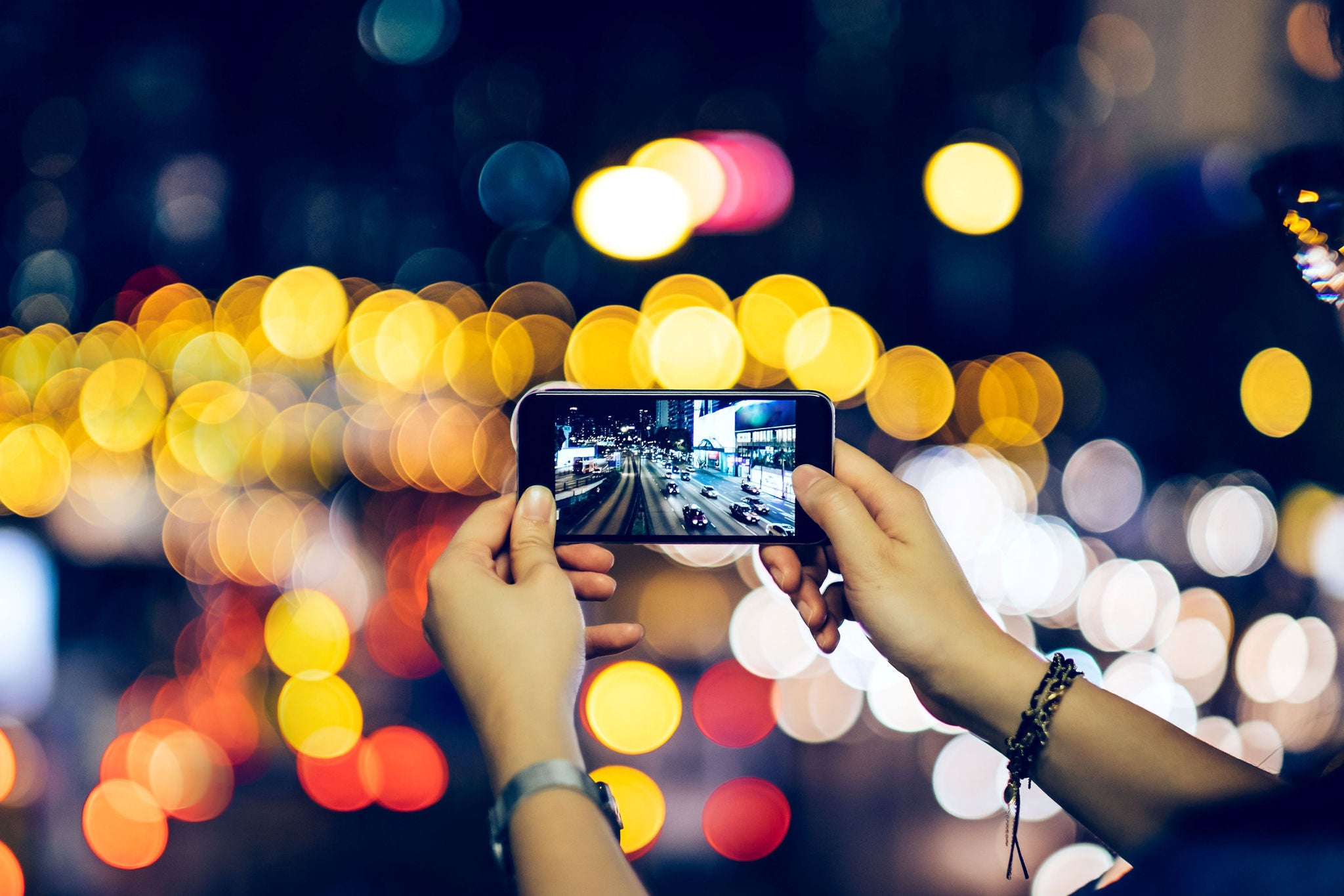 Woman looking at image in smart phone