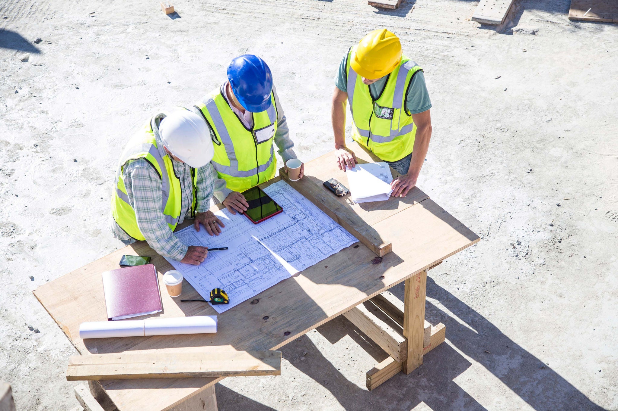 ey builder and architect on building site